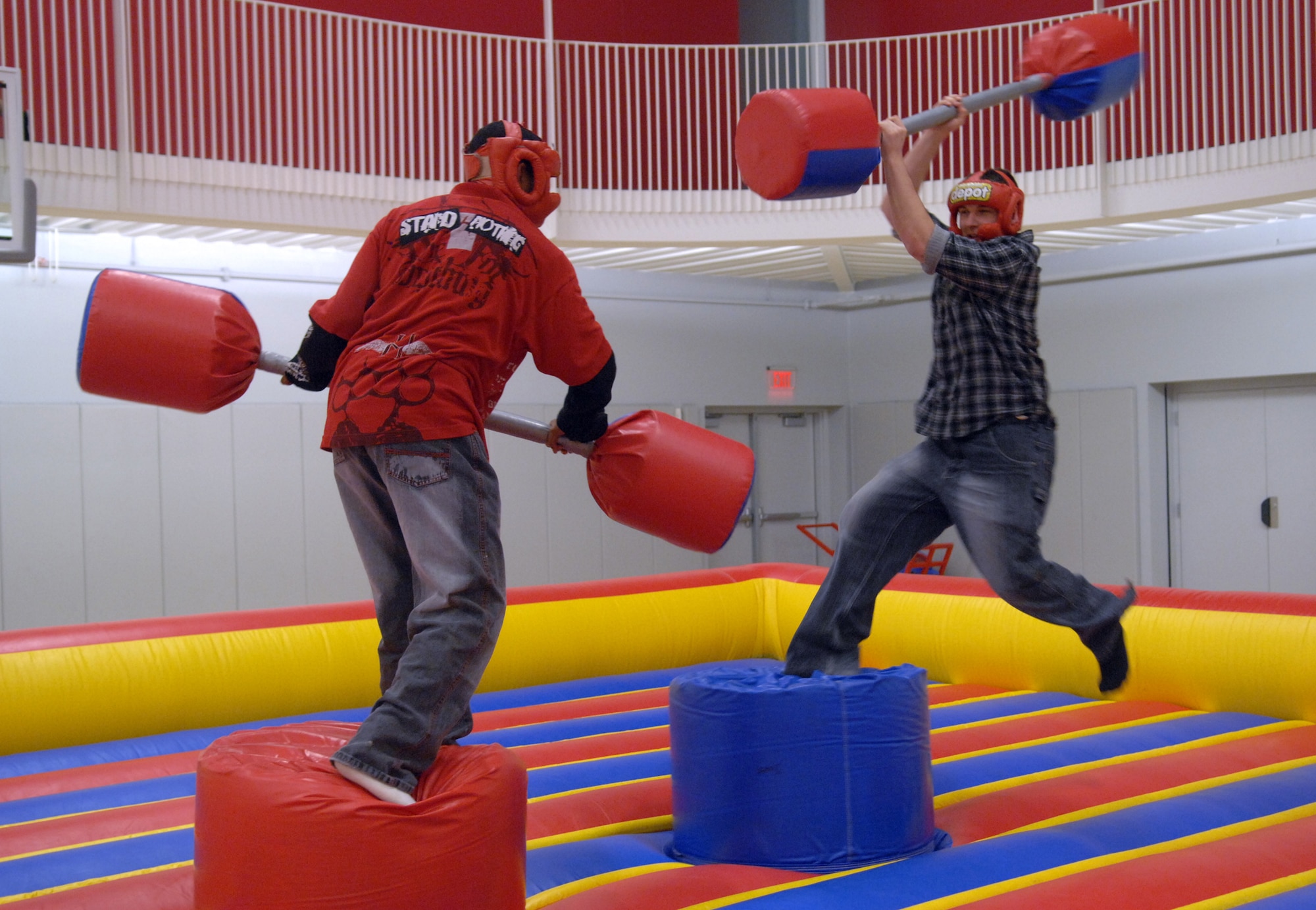 WARRENSBURG, Mo. -- Whiteman Airmen display their gladiatorial skills while battling with pugil sticks at the University of Central Missouri's Recreation Center March 18. UCM fun night was sponsored by UCM and Whiteman Air Force Base. (U.S. Air Force photo by Airman 1st Class Cody H. Ramirez)


