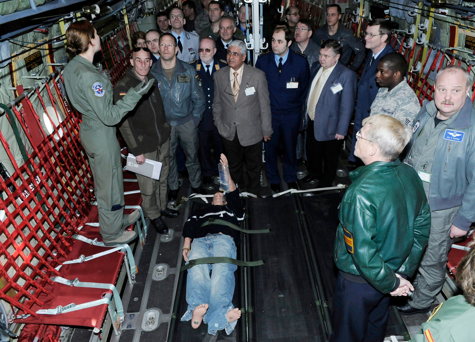 Senior Airman Teryn Granger explains critical patient care on a C-130J Super Hercules March 15, 2011, at Ramstein Air Base, Germany, during the 2011 European Flight Surgeons Conference. The focus of the conference is to build partnerships and develop advancements in aeromedical evacuation and critical-care air transport. Airman Granger is assigned to the 86th Aeromedical Evacuation Squadron. (U.S. Air Force photo/Airman 1st Class Desiree Esposito)