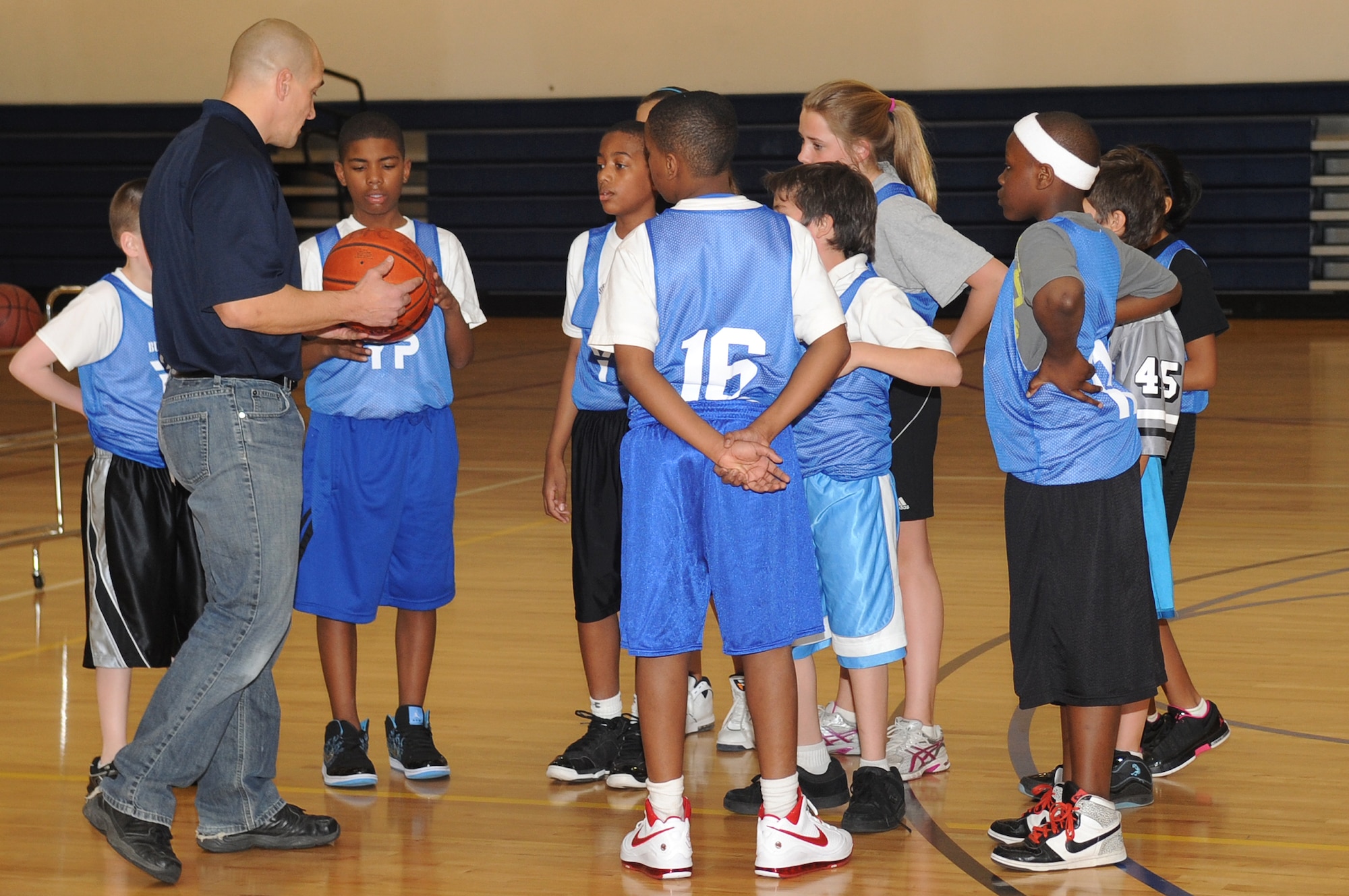 BUCKLEY AIR FORCE BASE, Colo.-- The Buckley Panthers huddle up before starting their game at the Fitness Center March 11, 2011. All players signed up, there were no tryouts held. (U.S. Air Force photo by Airman Manisha Vasquez)