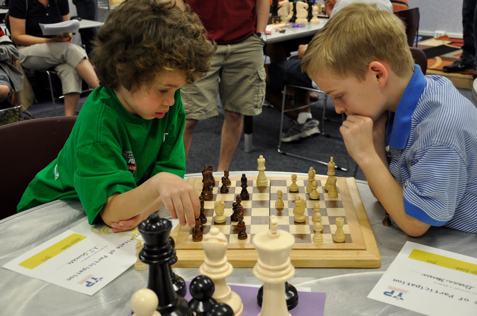 A.J. Trimble (left) and Gracin Harris peer over a chess board during the Randolph Youth Center’s chess tournament March 12. Gracin Harris was the winner in the 6- to 8-year old group. Christopher Phan and Eric Ayers (not pictured) were the winners of the 9- to 12- and 13- to 15- year old groups, respectively.
(Courtesy photo)