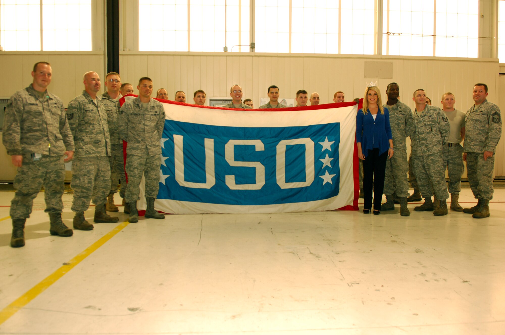 Ms. Teresa Scanlan, Miss America 2011, greets Airmen from the 27th Aircraft Maintenance Unit, at the 27th Fighter Squadron at Langley Air Force Base, Va., March 21, 2011. Miss Scanlan, an avid supporter of the U.S. Armed Forces, visited Langley as part of a USO event to promote esprit de corps and morale among Airmen. During her visit, Miss Scanlan toured the 1st Fighter Wing’s fighter squadrons, the base exchange and the installation’s Airman and family support facilities. (U.S. Air Force photo by Airman 1st Class Camilla Elizeu/RELEASED)