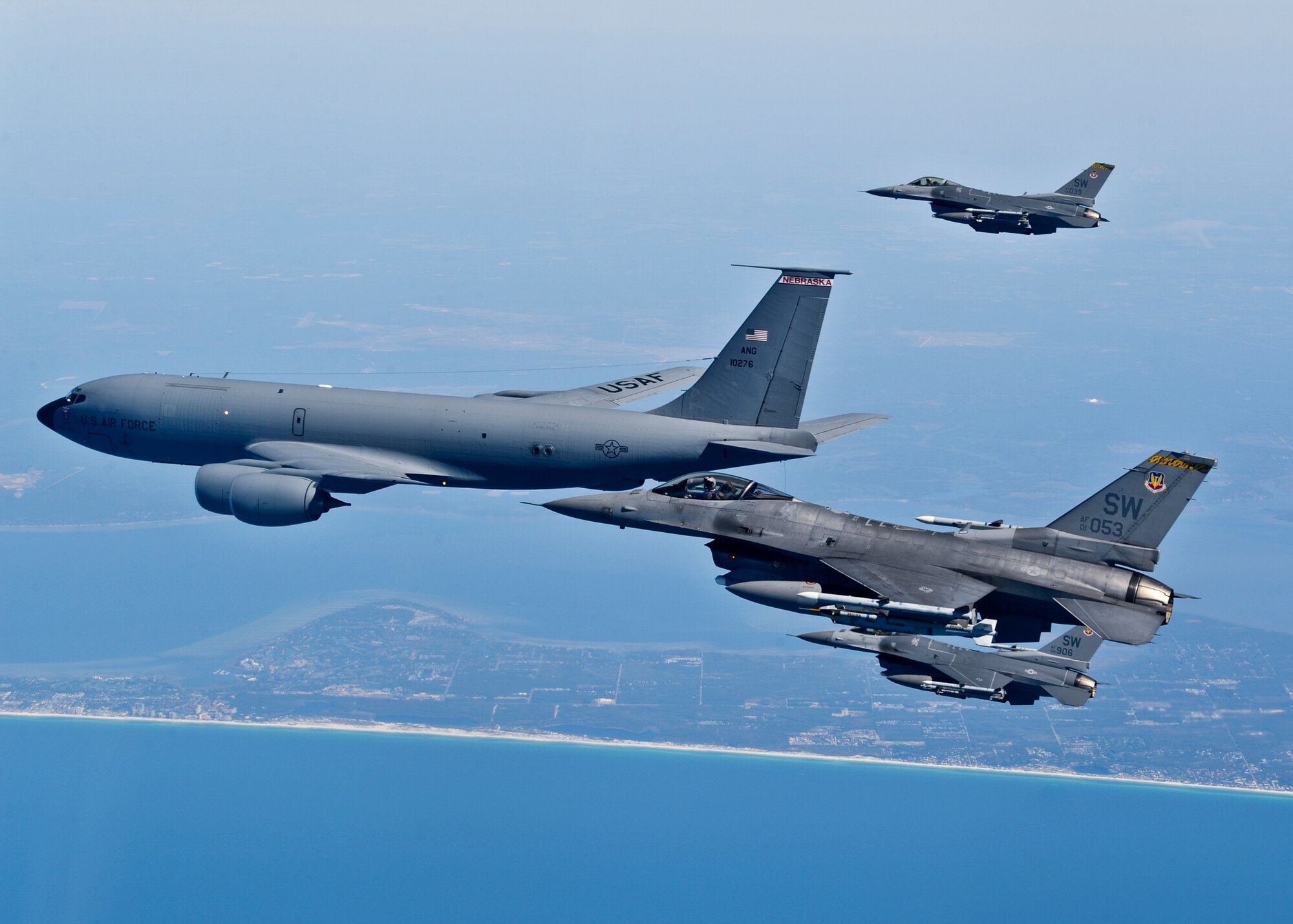 F-16 Fighting Falcons from the 20th Fighter Wing soar over the coastline of North West Florida during a Combat Hammer sortie mission March 17.  More than 10 F-16s from the 20th Fighter Wing were on hand to participate in the air-to-ground weapons system evaluation program known as Combat Hammer at Eglin.  The week-long evaluation is conducted by the 86th Fighter Weapons Squadron, located here.  The squadron hosts 20 to 25 evaluations at Hill and Eglin each year, assessing weapon system performance, reliability, capabilities, and limitations in realistic combat scenarios against representative real-world targets.  (Courtesy photo.)