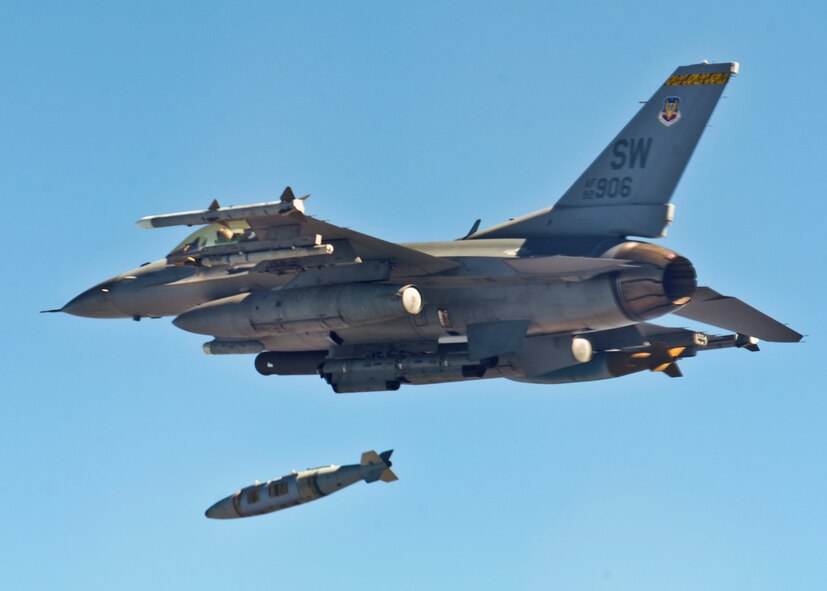 An F-16 Fighting Falcon from the 20th Fighter Wing releases a Guided Bomb Unit-31 over the Eglin Air Force Base range March 16.  Approximately 10 F-16s from the 20th Fighter Wing were on hand to participate in the air-to-ground weapons system evaluation program known as Combat Hammer at Eglin.  The week-long evaluation is conducted by the 86th Fighter Weapons Squadron, located here.  The squadron hosts 20 to 25 evaluations at Hill and Eglin each year, assessing weapon system performance, reliability, capabilities, and limitations in realistic combat scenarios against representative real-world targets.  (Courtesy photo.)
