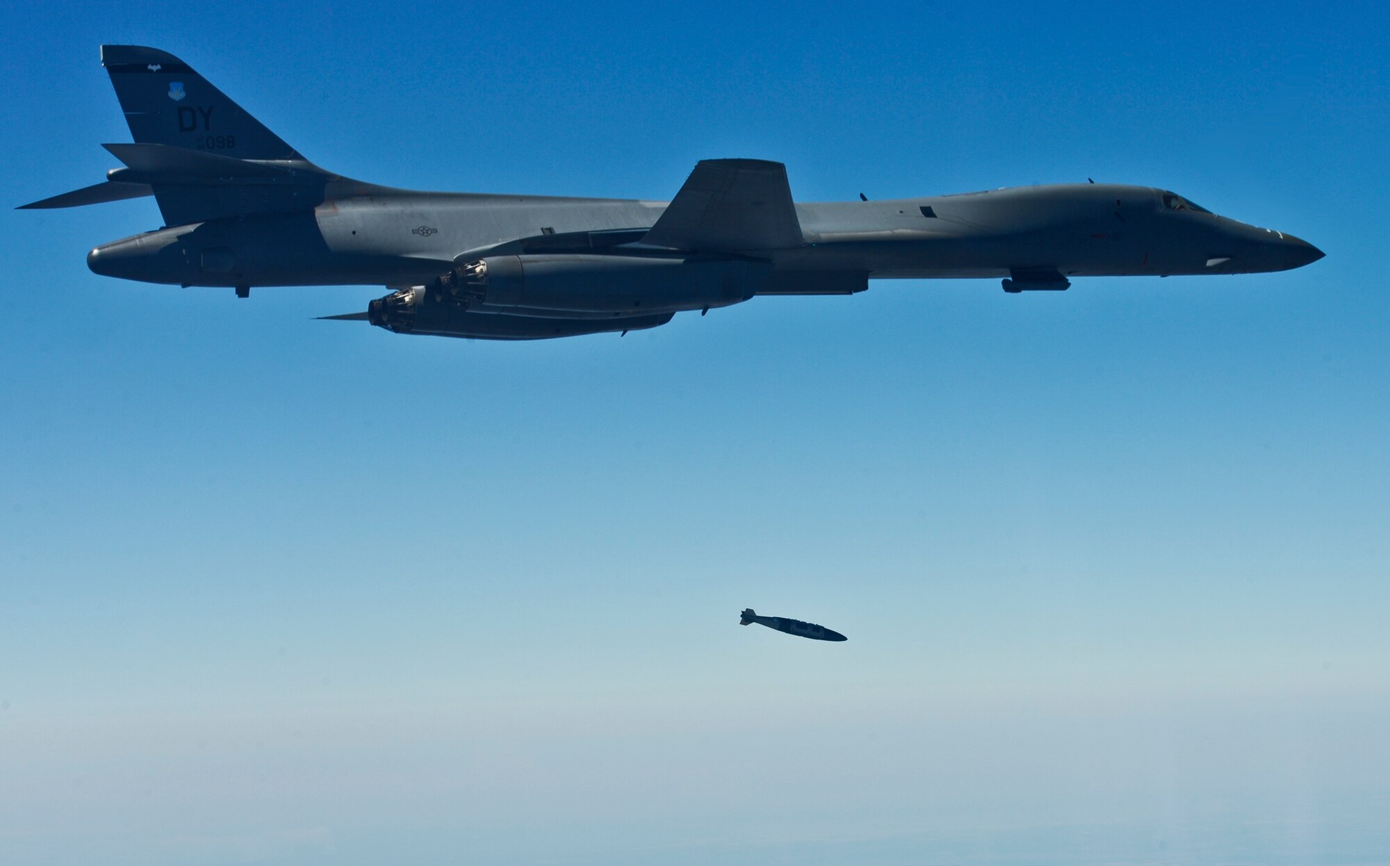 A B-1B Lancer releases a Guided Bomb Unit-32 during a Combat Hammer Sortie on the Eglin Air Force Base range March 16.  The bomber from the 7th Bomb Wing at Dyess AFB, Texas, participated in the week-long air-to-ground weapons system evaluation program known as Combat Hammer. The 86th Fighter Weapons Squadron hosts 20 to 25 evaluations at Hill and Eglin each year, assessing weapon system performance, reliability, capabilities, and limitations in realistic combat scenarios against representative real-world targets.  (Courtesy photo.)