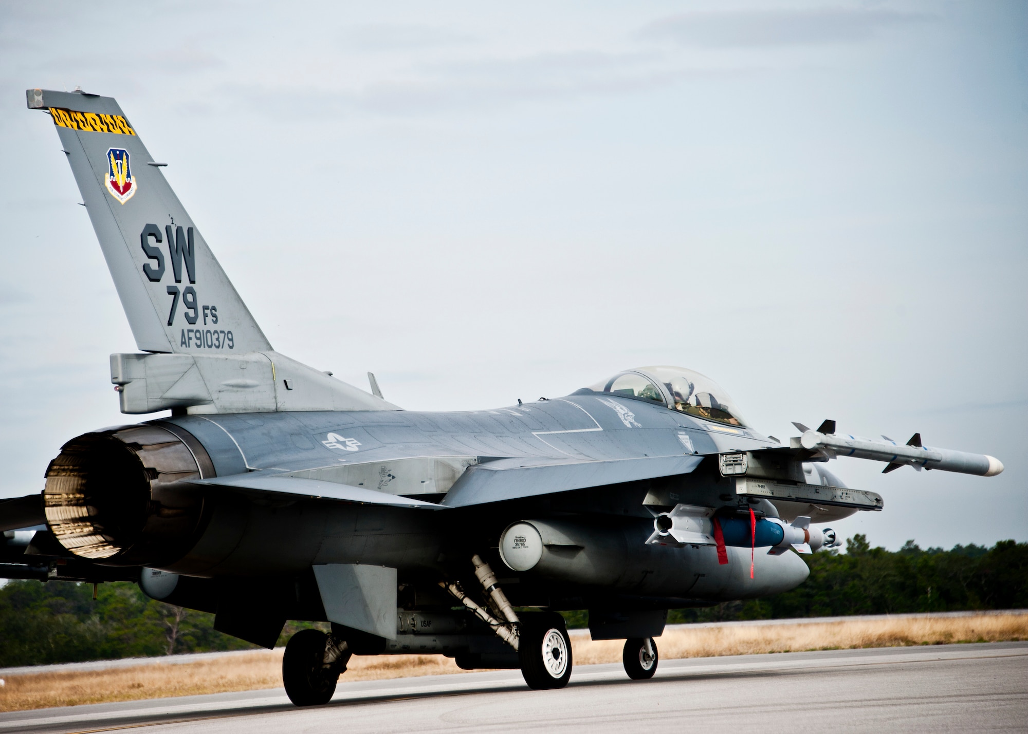 An F-16 Fighting Falcon loaded with a Guided Bomb Unit-12 from the 20th Fighter Wing waits to taxi out for a sortie March 14 at Eglin Air Force Base, Fla.  More than 10 F-16s from the 20th Fighter Wing were on hand to participate in the air-to-ground weapons system evaluation program known as Combat Hammer at Eglin.  The week-long evaluation is conducted by the 86th Fighter Weapons Squadron, located here.  The squadron hosts 20 to 25 evaluations at Hill and Eglin each year, assessing weapon system performance, reliability, capabilities, and limitations in realistic combat scenarios against representative real-world targets.  (U.S. Air Force photo/Samuel King Jr.)