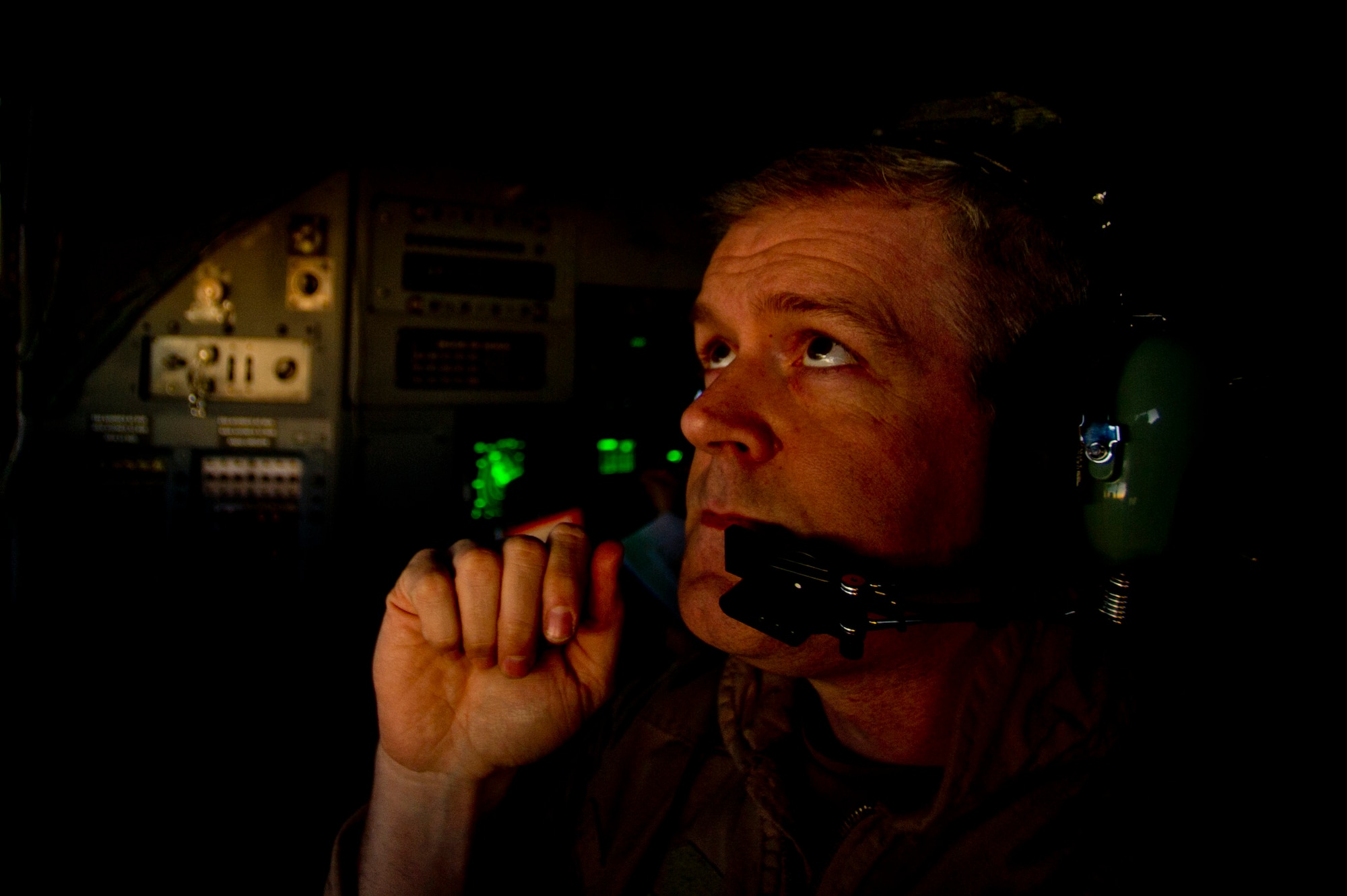 Senior Master Sgt. Christopher Janik, 746th Expeditionary Airlift Squadron C-130 Hercues flight engineer performs his in-flight aircrew duties during an air transport mission in support of Operation New Dawn. The C-130 crew transported soldiers from the 4th Infantry Division out of Iraq on the first leg of their return trip home after completing their deployment. Sergeant Janik is deployed from the 914th Airlift Wing, Niagara Falls, N.Y. 