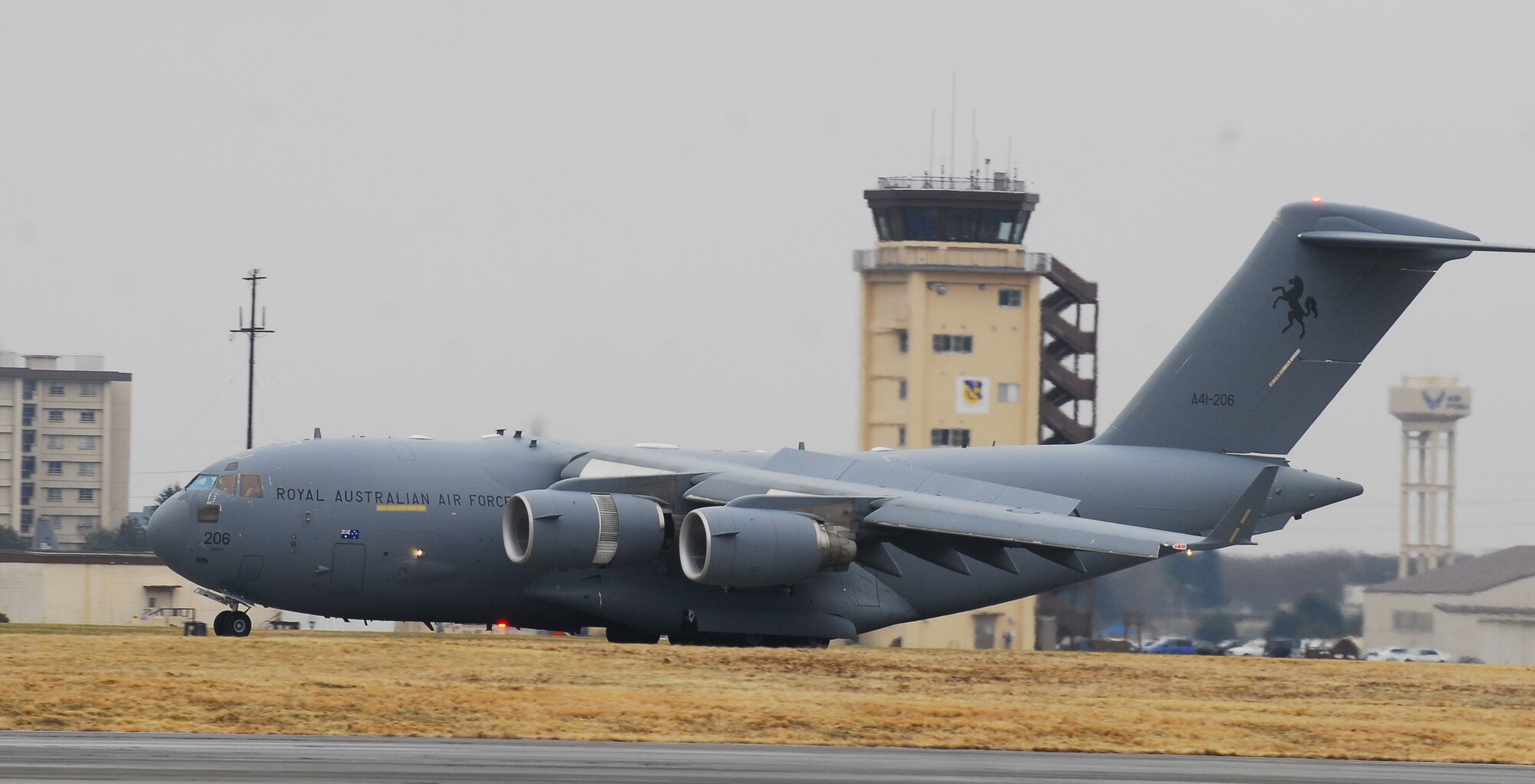 YOKOTA AIR BASE, Japan -- A Royal Australian Air Force C-17 Globemaster III carrying a water cannon system lands at Yokota March 22. The system is a series of pumps and trailers that can be remotely operated. (U.S. Air Force photo/Staff Sgt. Robin Stanchak)