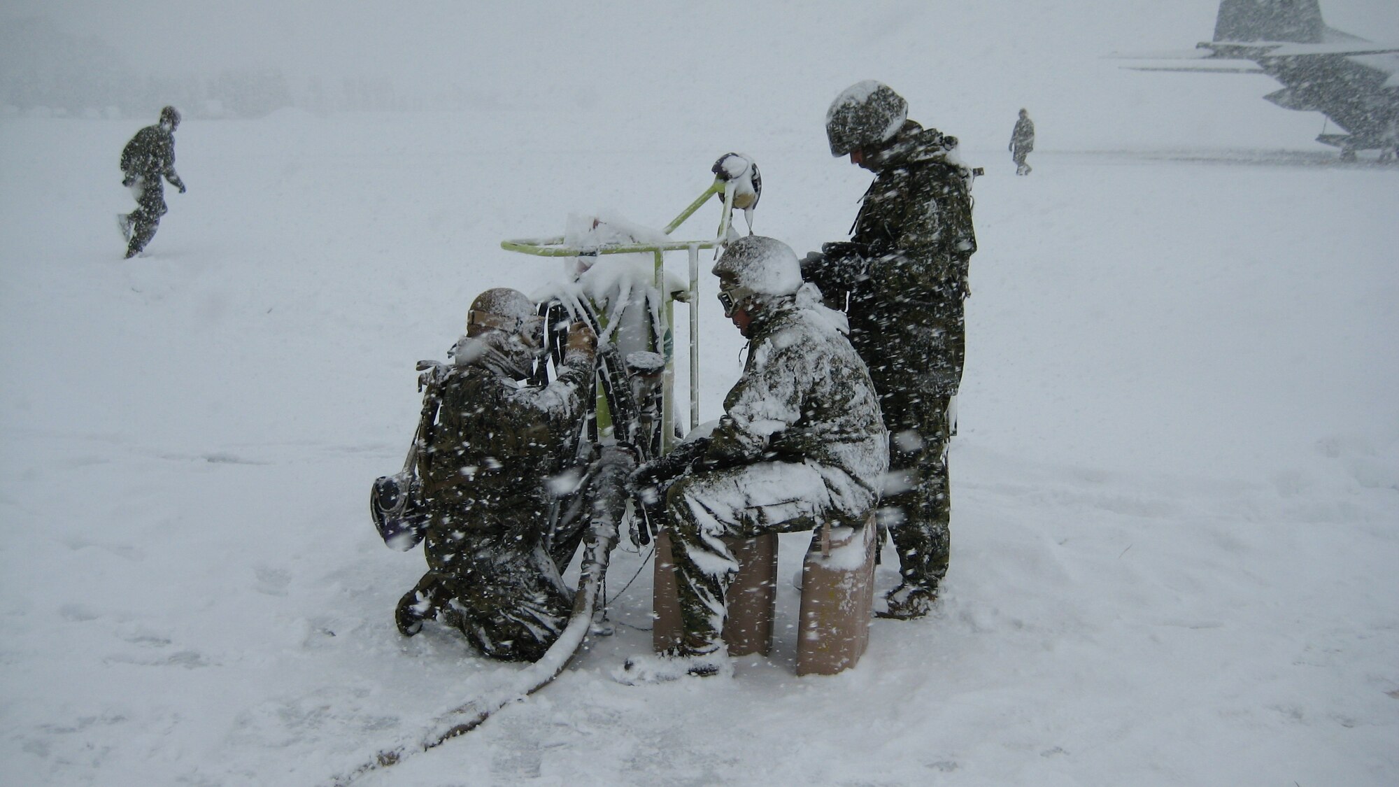 YAMAGATA, Japan -- Airmen from the 374th Logistics Readiness Squadron Fuels Management Flight work with Marines at a forward area refueling point in support of humanitarian assistance/disaster relief efforts March 18. A FARP allows aircraft to operate from airfields where fuel is not usually available. The 374th LRS sent four Airmen and an R-11 fuel truck to augment the Marines. (Courtesy photo)