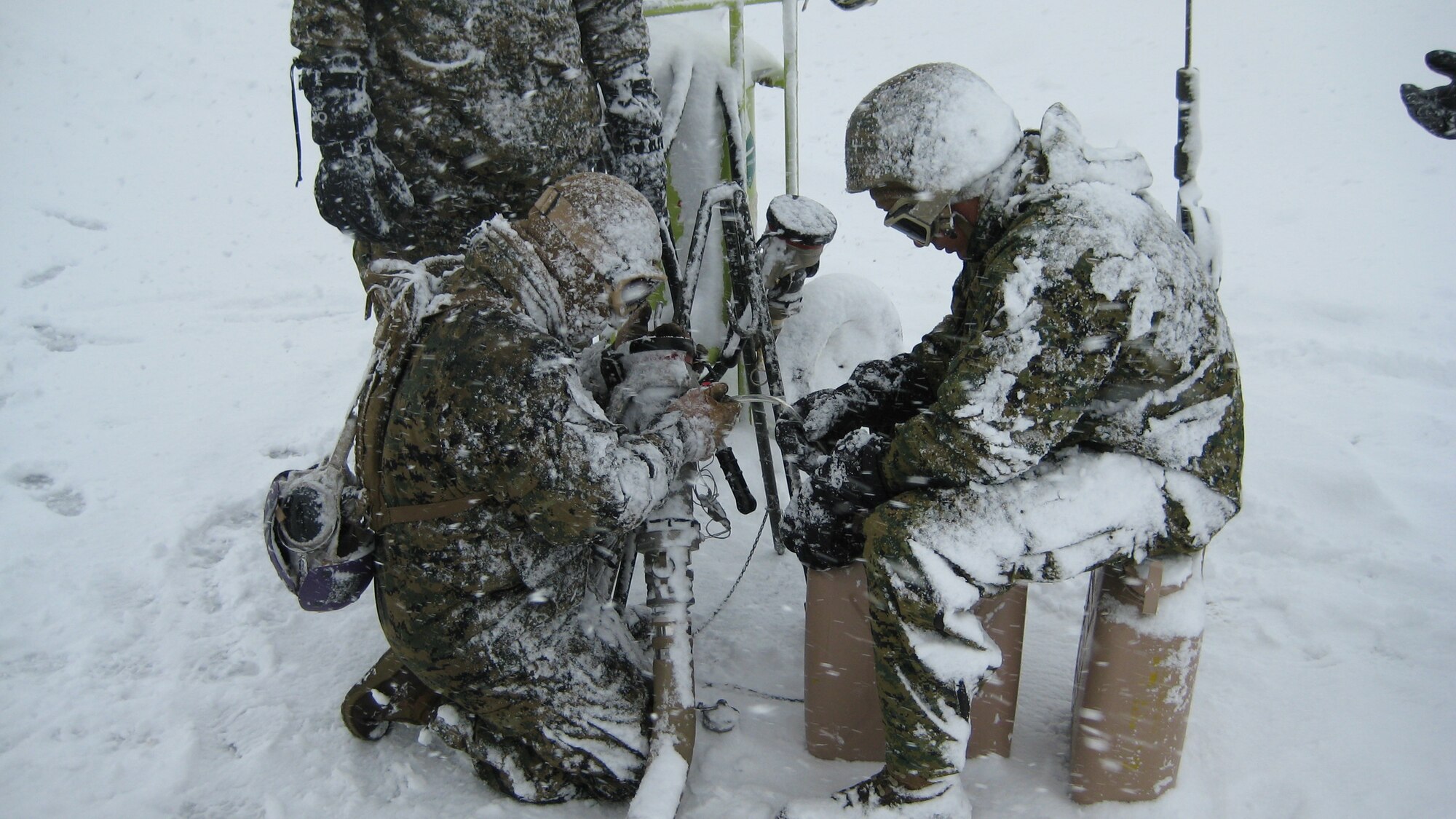 YAMAGATA, Japan -- Airmen from the 374th Logistics Readiness Squadron Fuels Management Flight work with Marines at a forward area refueling point in support of humanitarian assistance/disaster relief efforts March 18. A FARP allows aircraft to operate from airfields where fuel is not usually available. The 374th LRS sent four Airmen and an R-11 fuel truck to augment the Marines. (Courtesy photo)