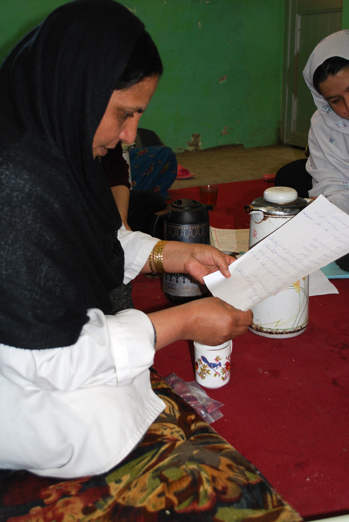 Dr. Saliyah, a midwife at the women's clinic in Qalat City,discusses the problems she is having with education the women who she attends to. (U.S. Air Force photo/Tech. Sgt. Stacia Zachary)