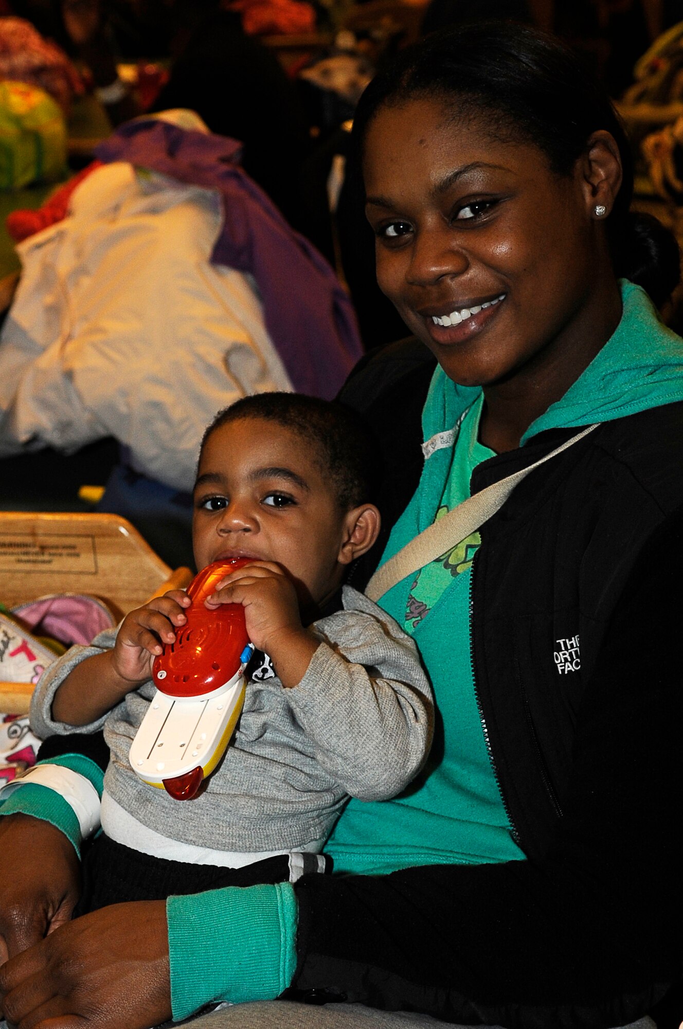 Brittany Bennett waits with her son, Jaden, hours before leaving Yokota on a volunatry assisted departure March 22, 2011. Military dependents waited at the Enlisted club, before being transported to the Passenger Terminal. (U.S. Air Force photo/Master Sgt. Jeromy K. Cross)








