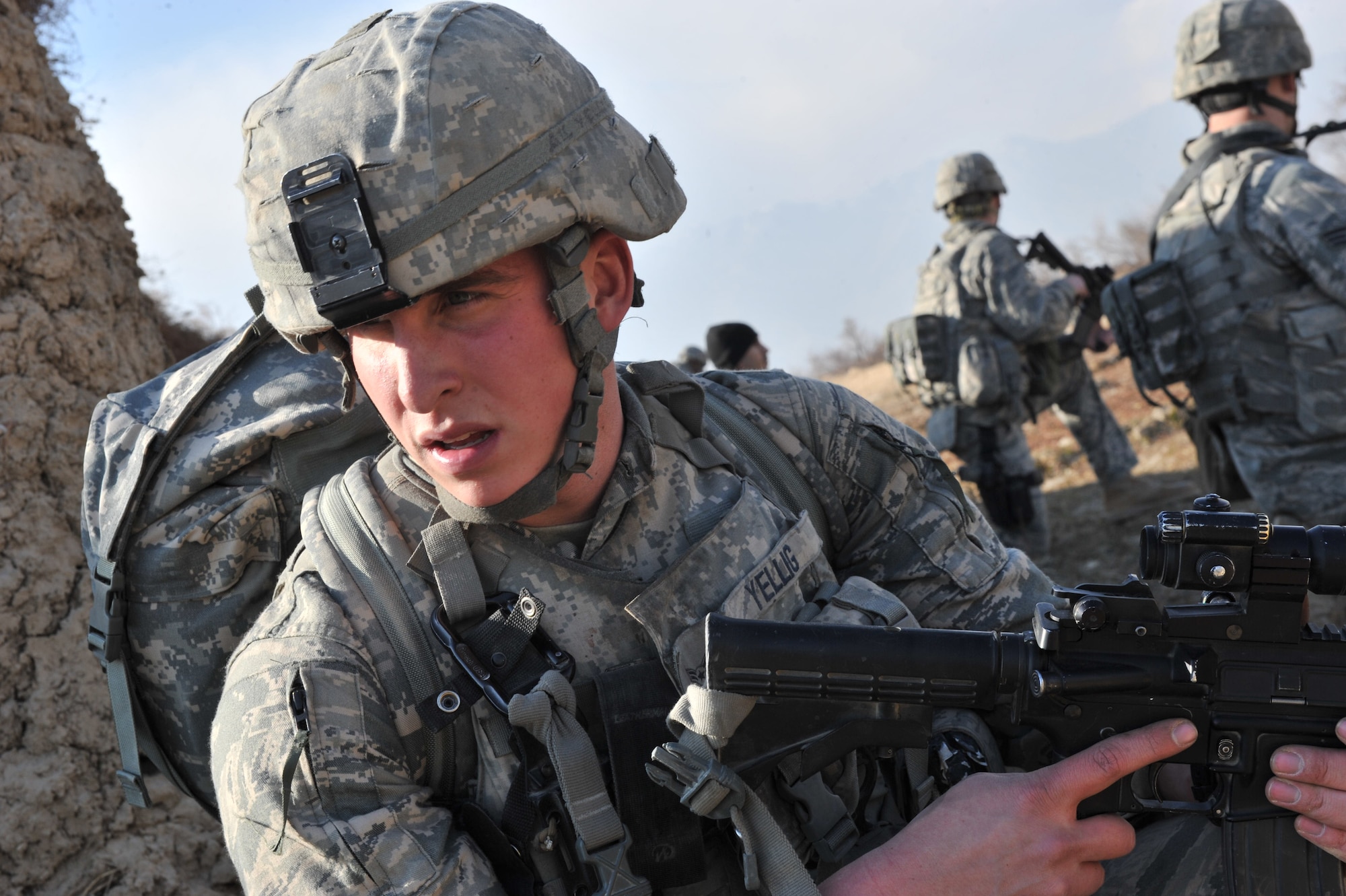 Senior Airman Christopher Yellig, 455th Expeditionary Security Forces Squadron, surveys the area during a routine patrol outside Bagram Airfield, Afghanistan, Jan. 17, 2011. Security Forces members visited a village to build a relationship with the Afghan locals and donated blankets during the cold winter months. Airman Yellig is deployed from Ramstein Air Base, Germany. (U.S. Air Force photo by Senior Airman Sheila deVera)