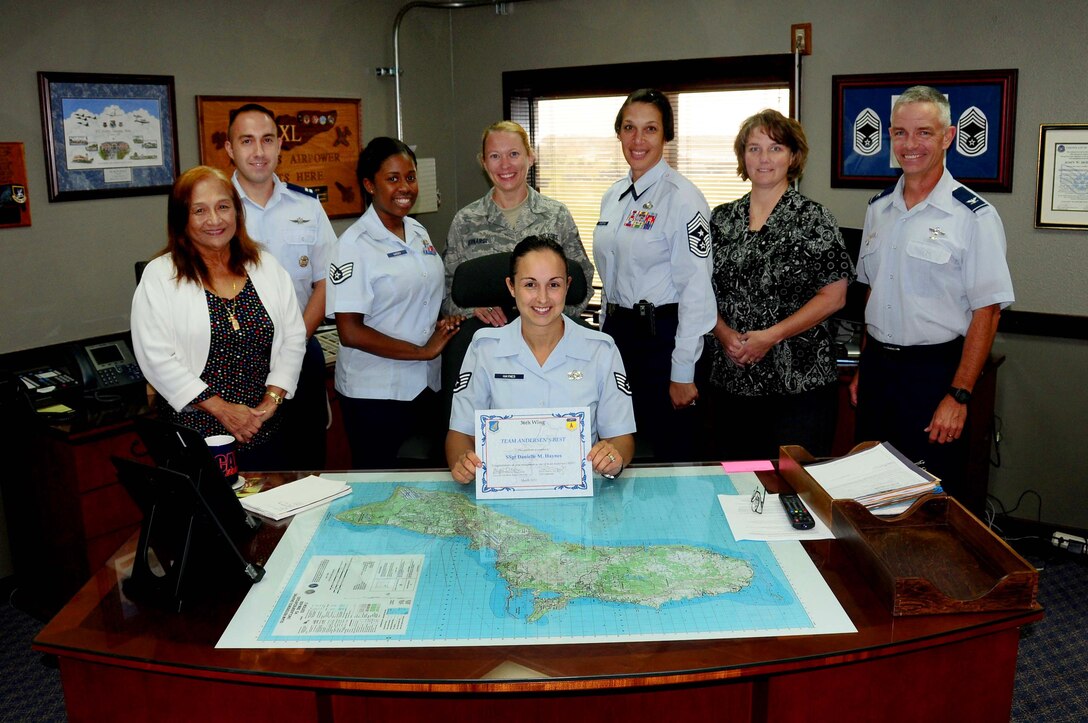 Staff Sgt. Danielle Haynes, 36th Wing Command Section Knowledge Operations noncommissioned officer, poses with her co-workers after receiving the Andersen’s Best award, March 21. Sergeant Haynes was nominated for her excellent work ethic and high level of performance in diverse jobs and duties, including handling computer systems administrator duties for 100 Wing Staff Agency computer users.(U.S. Air Force photo/Airman 1st class Jeffrey Schultze)