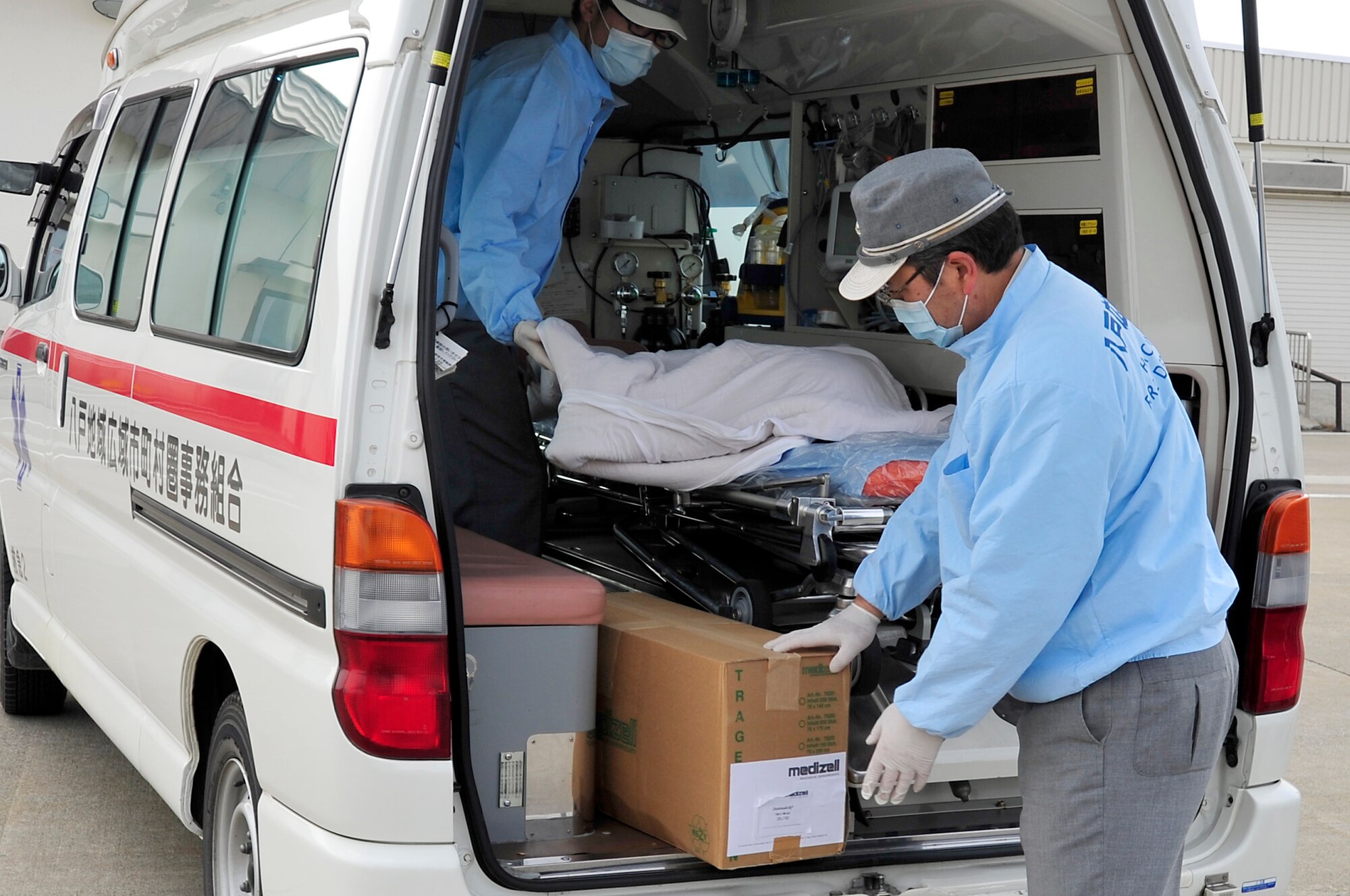 MISAWA AIR BASE, Japan -- Hachinohe Fire Department workers load supplies donated by the Swiss medical facilities Mar. 21. Supplies were donated to help with resupplying the Hachinohe hospitals to aid victims affected by the tsunami that hit the area Mar. 11. (U.S. Air Force photo by Staff Sgt. Marie Brown\Released)
