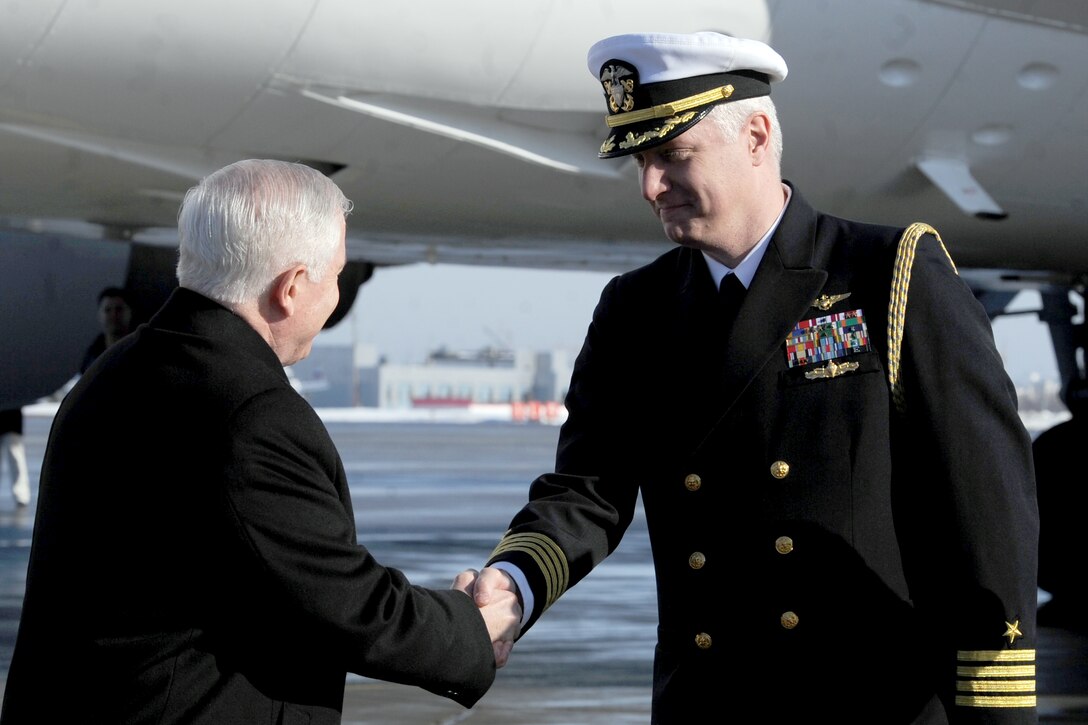 U.S. Navy Capt. Steve Krotow greets U.S. Defense Secretary Robert M. Gates upon his arrival at the Vnukovo International Airport in Moscow, March 22, 2011. Krotow is the naval attache for the U.S. Defense Attache Office in Moscow. 
