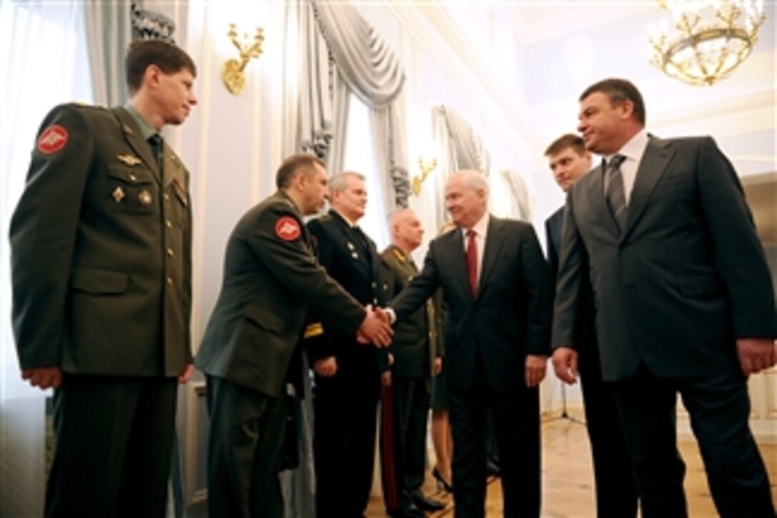 Secretary of Defense Robert M. Gates meets with Russian officers at the Ministry of Defense Guest House prior to a meeting with Russian Defense Minister Anatoly Serdyukov (right) in Moscow, Russia, on March 22, 2011.  
