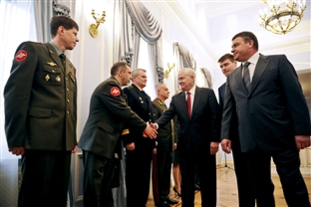 U.S. Defense Secretary Robert M. Gates meets with Russian officers at the Ministry of Defense Guest House before a meeting with Russian Defense Minister Anatoly Serdyukov, right, in Moscow, March 22, 2011.