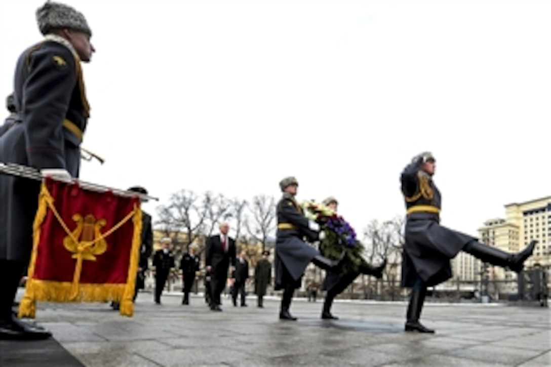 U.S. Defense Secretary Robert M. Gates stands as part of the ceremony to lay a wreath at the Tomb of the Unknown Soldier in Moscow, March 22, 2011.
