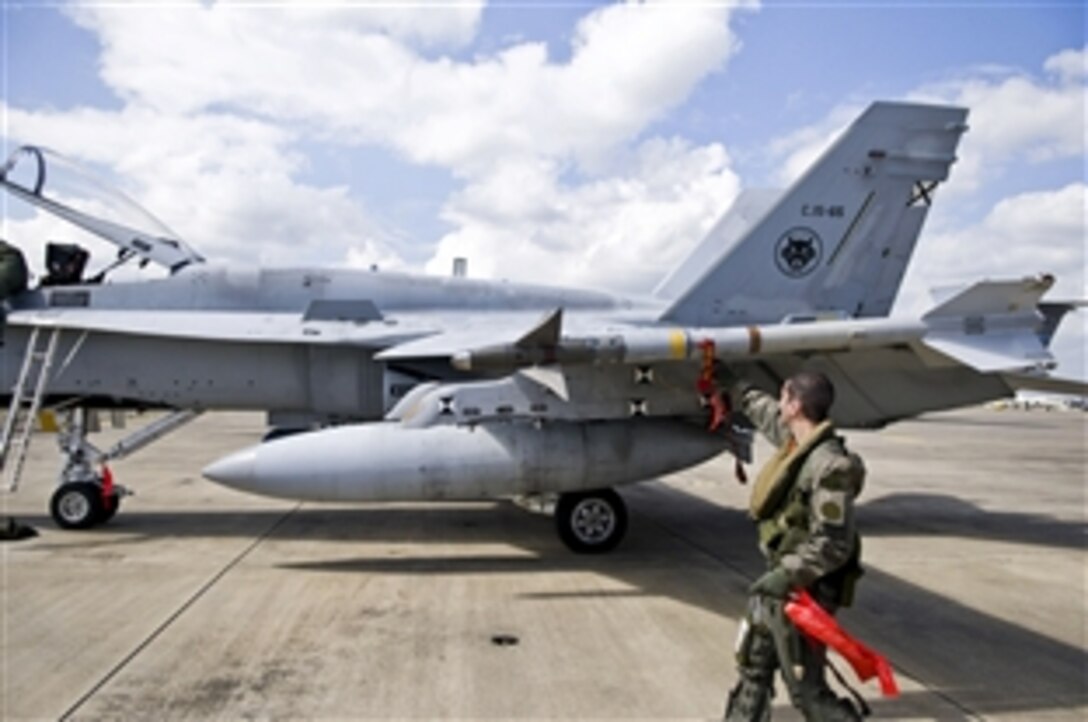 Spanish F-18 Fighters refuel on Naval Air Station Sigonella, Italy, March 22, 2011. These aircraft are part of Task Force Odyssey Dawn, the U.S. Africa Command task force to provide operational and tactical command and control of U.S. military forces supporting the international response to the unrest in Libya.