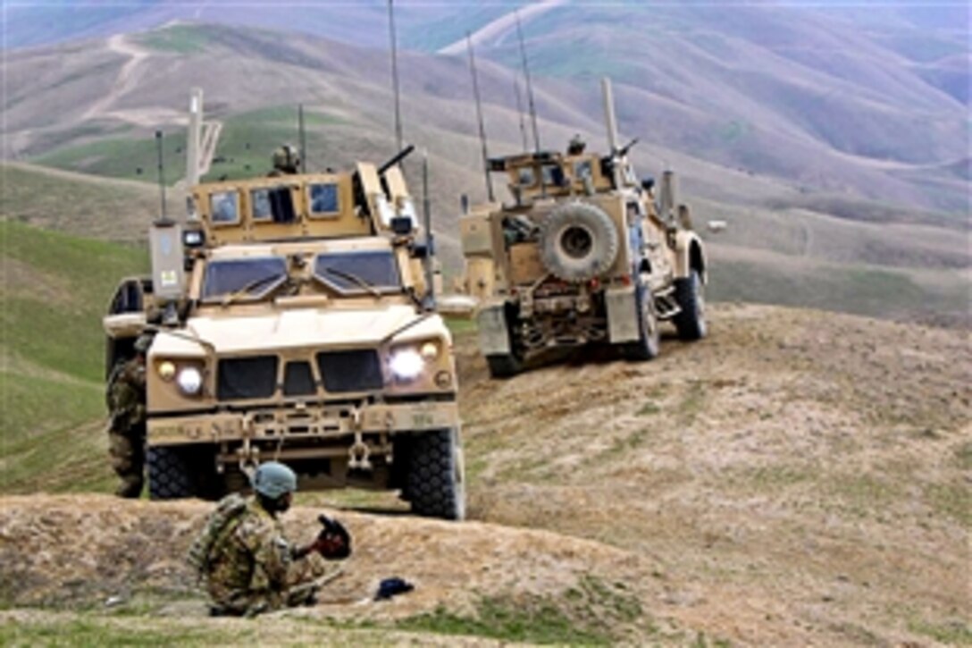 U.S. Army soldiers visit an Afghan police checkpoint to build further cooperation in Pul-E Khumri, Afghanistan, March 18, 2011. The soldiers are assigned to Company A, 2nd Battalion, 18th Infantry Regiment, 170th Infantry Brigade Combat Team.