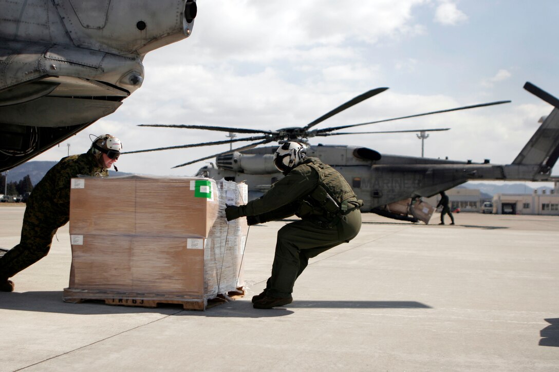 Marines with the 31st Marine Expeditionary Unit move pallets of supplies during a humanitarian aid and disaster relief mission, March 23. Navy and Marine Corps involvement is part of a larger U.S. government response, coordinated with the government of Japan's ongoing relief efforts, after a 9.0 earthquake and subsequent tsunami struck Japan causing widespread damage. As part of Operation Tomodachi, the 31st MEU is ready to support our Japanese partners and to provide assistance when called upon.