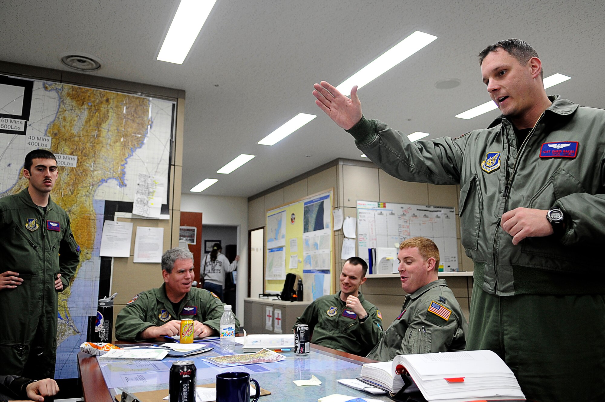YOKOTA AIR BASE, Japan -- Tech. Sgt. Chris Baker, 459th Airlift Squadron, briefs crew about the day's flight on a UH-1 Huey helicopter  leaving  Yokota for Tokyo, March 23. The helicopters are critical in providing logistical support by transporting general officers, Department of Energy personnel and other officials in support of Operation Tomodachi. (U.S. Air Force photo/Master Sgt. Jeromy K. Cross/released)






