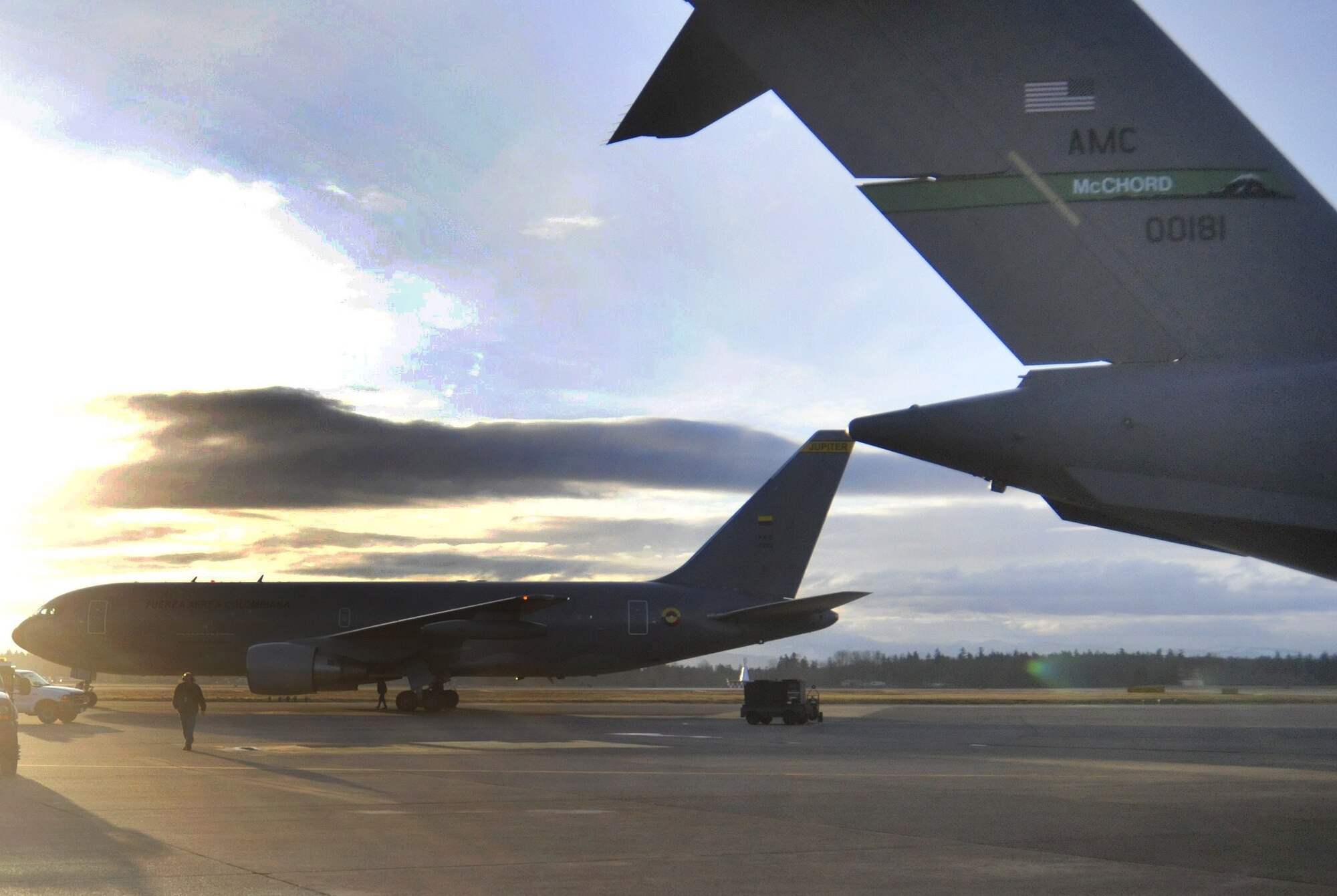 Team McChord assists the Columbian Air Force by refueling an aircraft March 22, 2011, at Joint Base Lewis-McChord, Wash. The aircraft moved more than 190 passengers, mostly Columbian citizens, from Japan’s Narita International Airport after an earthquake and tsunami stuck the island March 11. The aircraft transported the passengers back to Columbia. (U.S. Air Force photo/Airman 1st Class Leah Young)