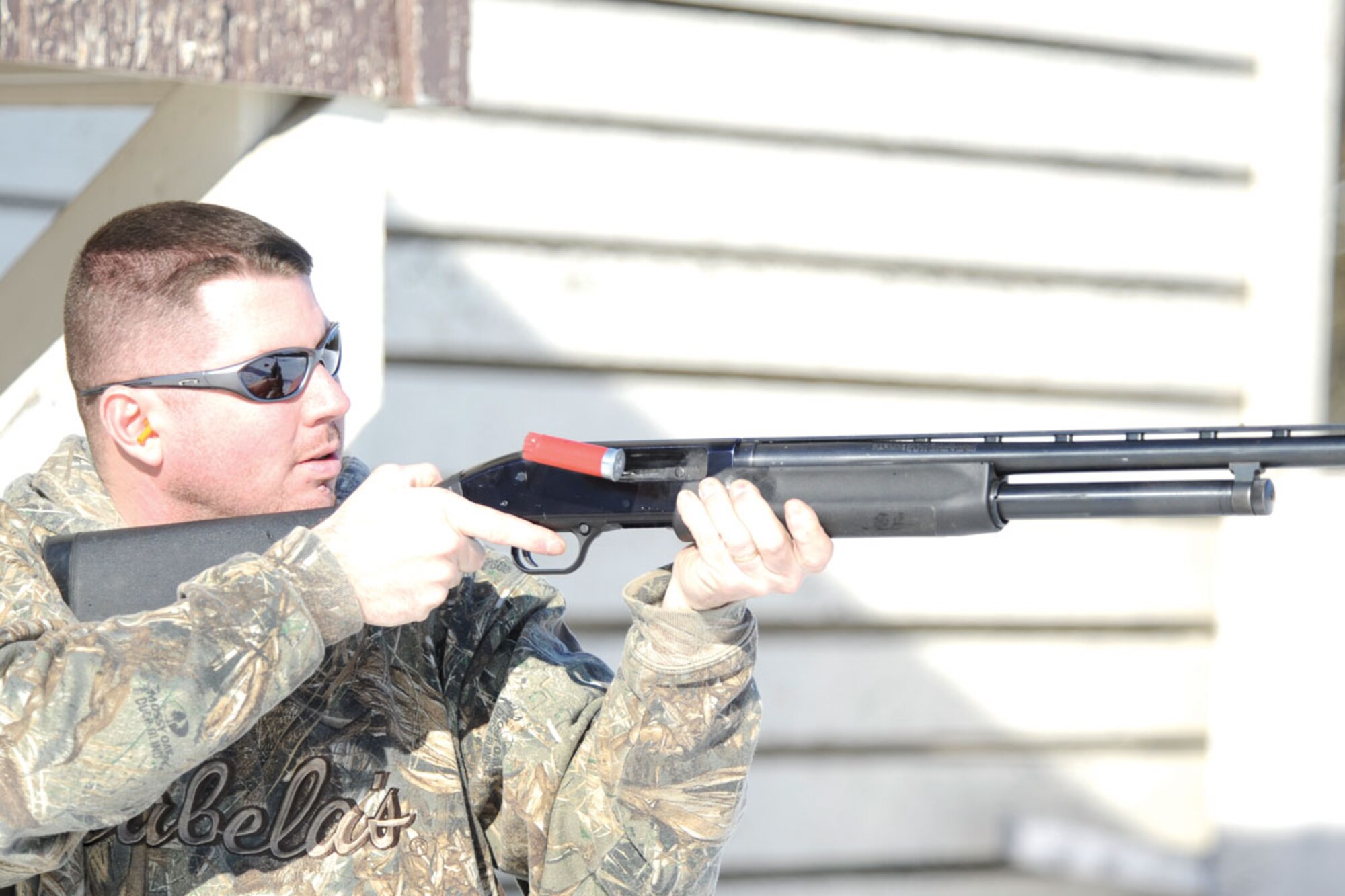 Tech. Sgt. David Gunn fires a shot during a round of skeet at the range on Joint Base Elmendorf-Richardson. (U.S. Air Force photo/Steve White)