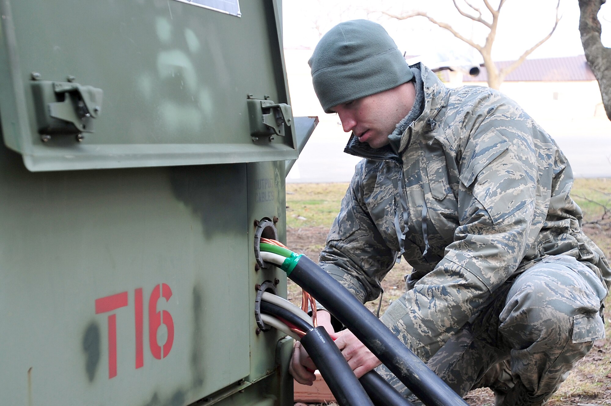 Airman 1st Class Aaron Cope wraps tape around exposed wires from a generator March 14, 2011, at Misawa Air Base, Japan. 35th Civil Engineer Squadron officials at Misawa ABissued a request for forces to assist with recovery operations. Airman Cope is assigned to the 18th Civil Engineer Squadron at Kadena Air Base, Japan.(U.S. Air Force photo/Staff Sgt. Marie Brown) 
