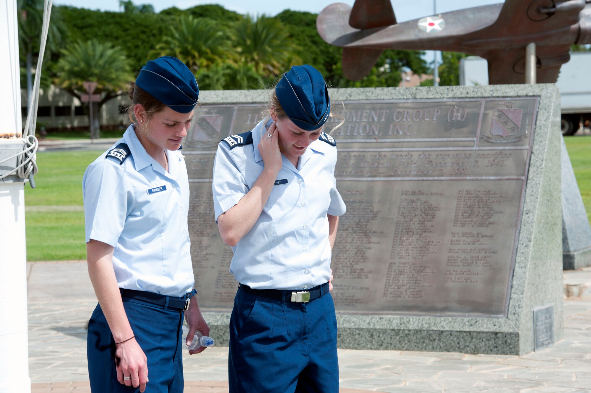Cadets 2nd Class Alexa Ramsier and Bridgett Murphy from the U.S. Air Force Academy read the historical plaques on display Mar. 21 in Atterbury Circle at Joint Base Pearl Harbor Hickam, Hawaii. The 15th Wing hosted the cadets from the "Fightin' Fourth" squadron at Peterson Air Force Base, Colo. during their week-long visit to the base. (U.S. Air Force photo/Staff Sgt. Nathan Allen)