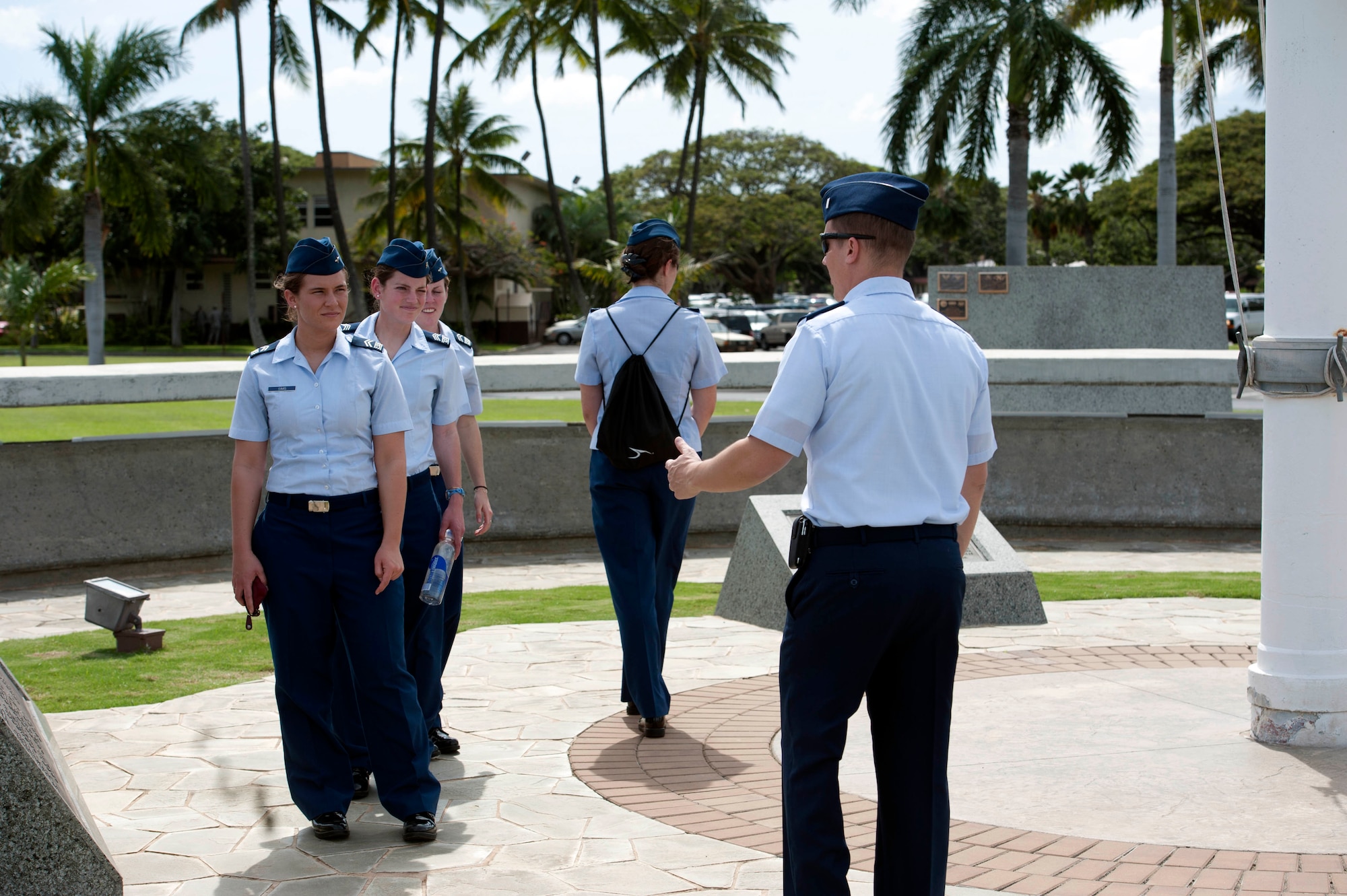 1st Lt. Jason Smith, 15th Wing Public Affairs deputy chief, discusses 15th Wing history with U.S. Air Force Academy cadets Mar. 21 in Atterbury Circle at Joint Base Pearl Harbor Hickam, Hawaii. The 15th Wing hosted the cadets from the "Fightin' Fourth" squadron at Peterson Air Force Base, Colo. during their week-long visit to the base. (U.S. Air Force photo/Staff Sgt. Nathan Allen)