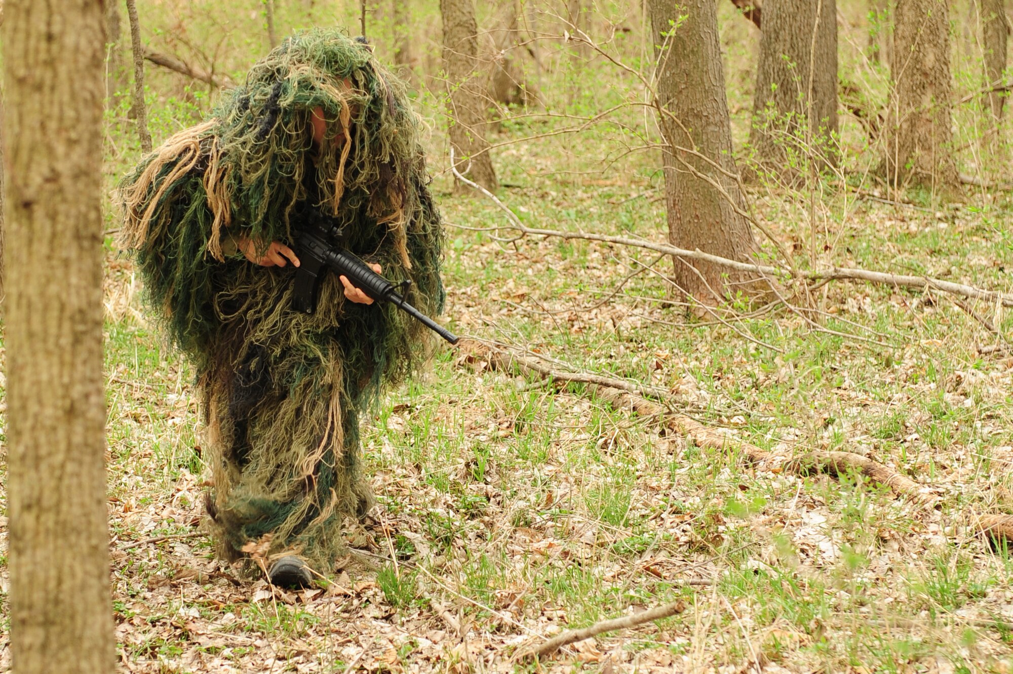 Tech. Sgt. Robert Graham, 375th Operations Support Squadron S.E.R.E specialist portrays a rescue team leader while carefully walking to his view point for on coming aircrew during  Combat Survival Training at the Illinois Army National Guard’s Sparta Training Area, Sparta, Ill. on March 22, 2011. S.E.R.E instructors train aircrew on the basic to advanced techniques of  survival, evasion, resistance, and escape. (U.S. Air Force photo by Staff Sgt. Teresa M. Jennings)