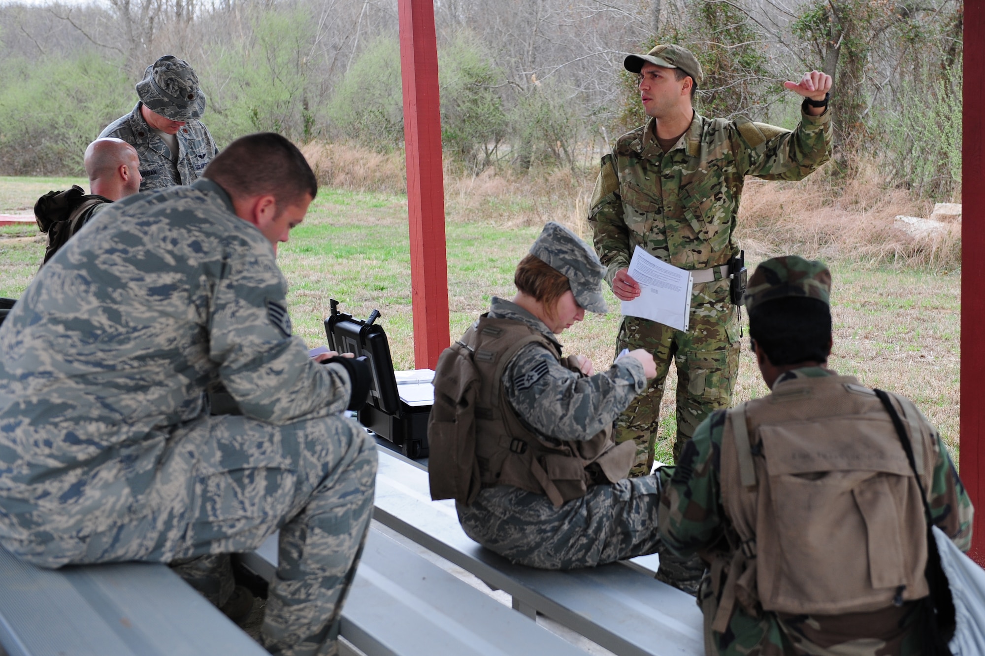 Tech. Sgt. Robert Graham, 375th Operations Support Squadron S.E.R.E specialist, gives a safety briefing during  Combat Survival Training at the Illinois Army National Guard’s Sparta Training Area, Sparta, Ill. on March 22, 2011. Combat Survival Training is held once a month for active aircrews and aeromedical personnel where they put their evasion skills to work. (U.S. Air Force photo by Staff Sgt. Teresa M. Jennings)