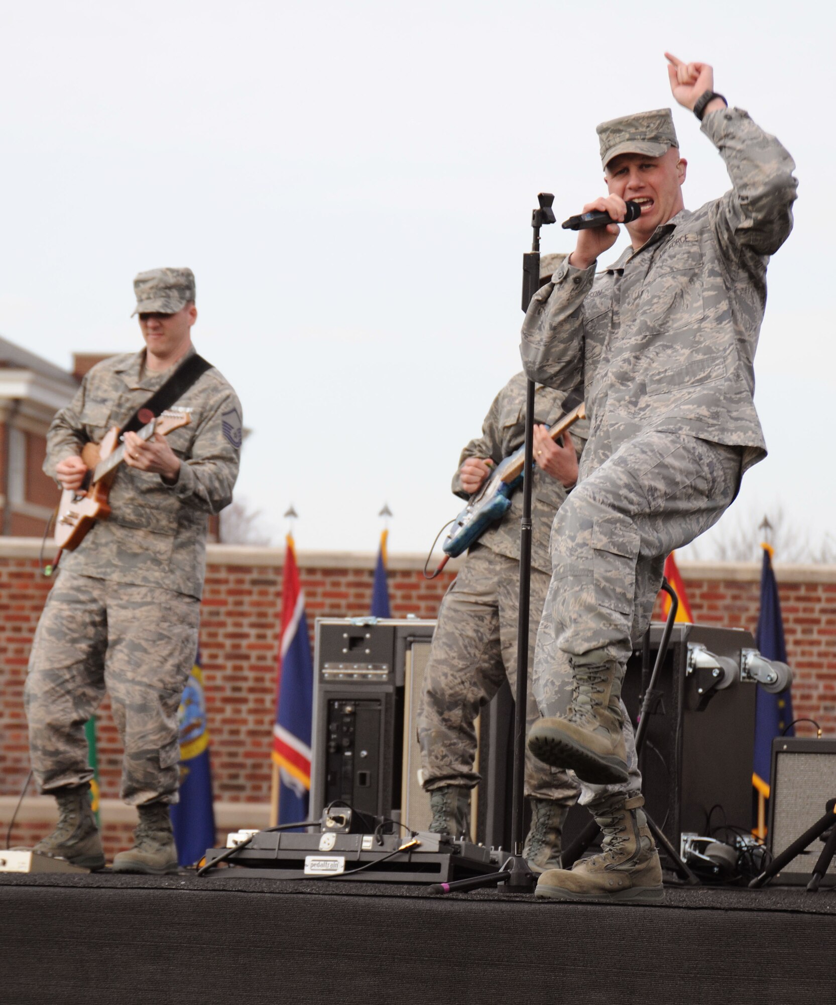 Master Sgt. Ryan Carson, lead singer of the Air Force Band's rock specialists, Max Impact, belts out the lyrics to "Send Me," a song written about the American Airman.  Max Impact entertained attendees at Col. Humble's assumption of command ceremony March 22. (U.S. Air Force photo by Senior Airman Torey Griffith)