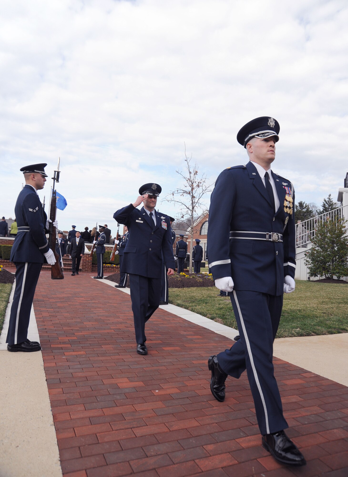Colonel Ken Rizer, 11th Wing/Joint Base Andrews commander, salutes members of the Air Force Honor Guard as he departs the 11th Operations Group assumption of command ceremony on Joint Base Anacostia-Bolling March 22. Colonel Gina Humble assumed command, and will lead the group "to a higher level of excellence." (U.S. Air Force photo by Senior Airman Torey Griffith)