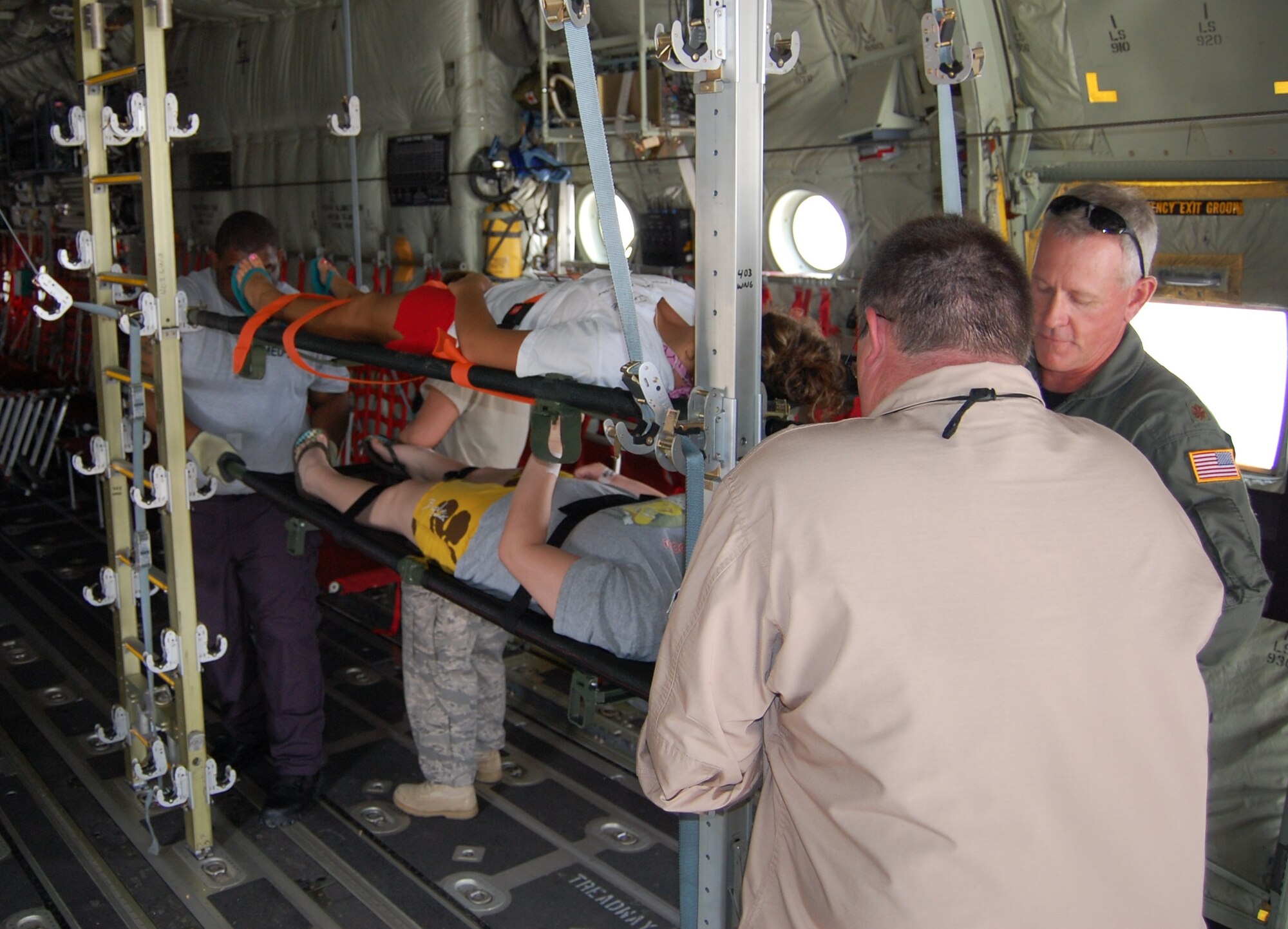 Medics from the 81st Medical Group and civilian agencies care for “patients” on a 403rd Wing C-130 Hercules on the Keesler flightline during the last major national-level exercise in May 2009.  (U.S. Air Force photo by Steve Pivnick)