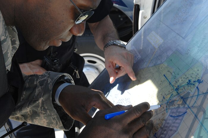 Tech. Sgt. Toma Ferguson plots out the cordon during a Mass Accident
Response Exercise at Joint Base Charleston, SC, Mar. 22. The MARE prepares
all Joint Base Charleston emergency responders for the upcoming 2011 Air.
Sergeant Ferguson is assigned to the 628th Security Forces Squadron (U.S.
Air Force photo by Senior Airman Brianna Veesart) 

