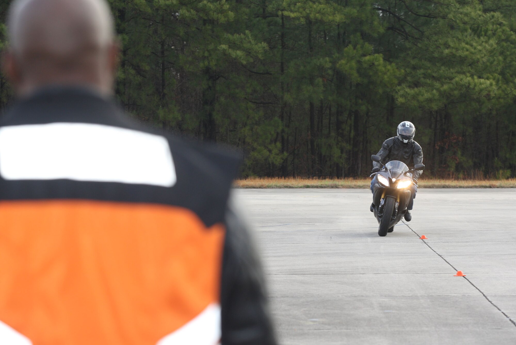 Rider coaches observe the riders as they maneuver through the various course configurations Mar 16. (U.S. Air Force Photo/Don Peek)