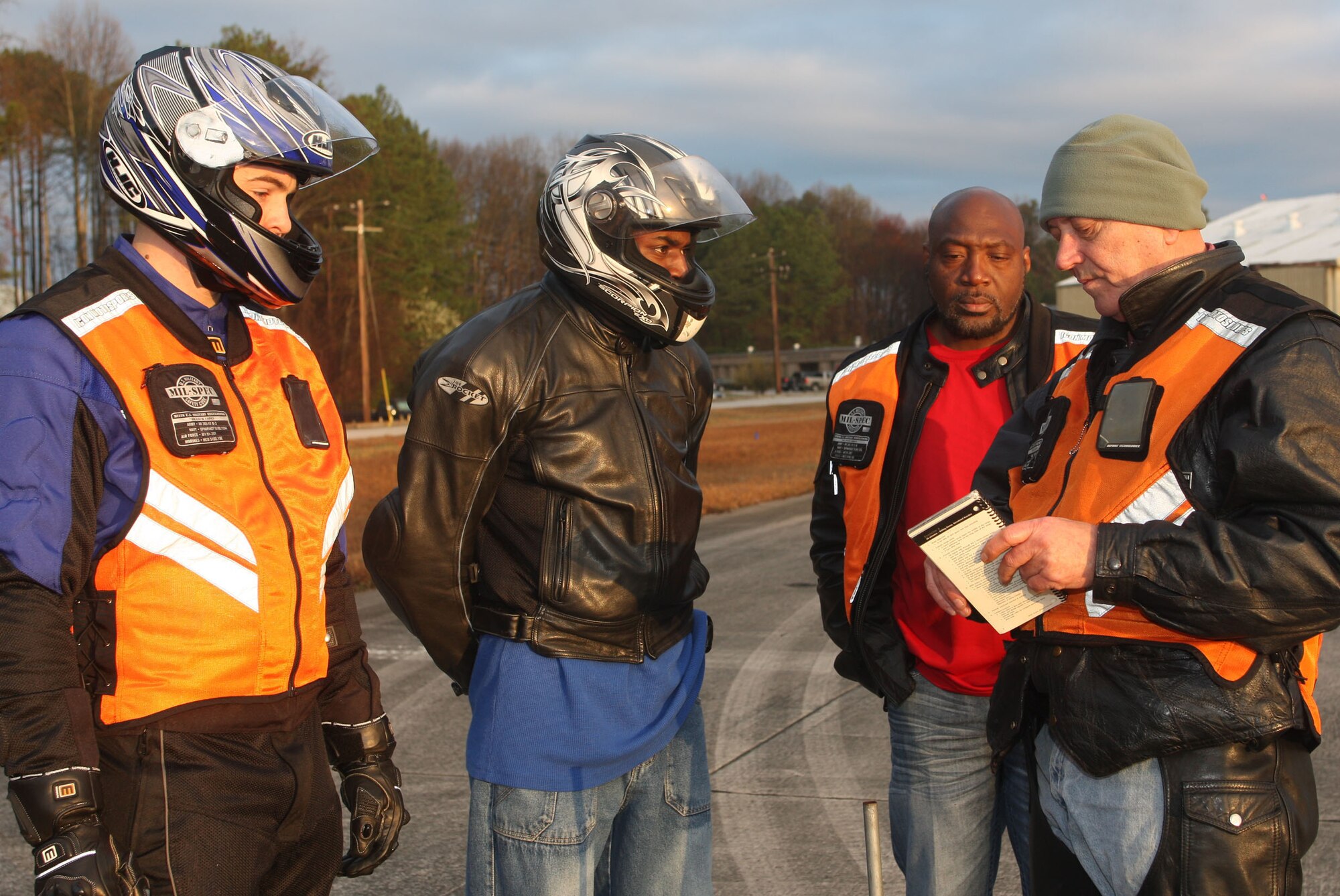 On the motorcycle range riders are briefed by rider coaches Senior Master Sgt. Earl Davis from the Transportation Proficiency Center and Mark Daniel prior to each riding scenario Mar 16. (U.S. Air Force Photo/Don Peek)