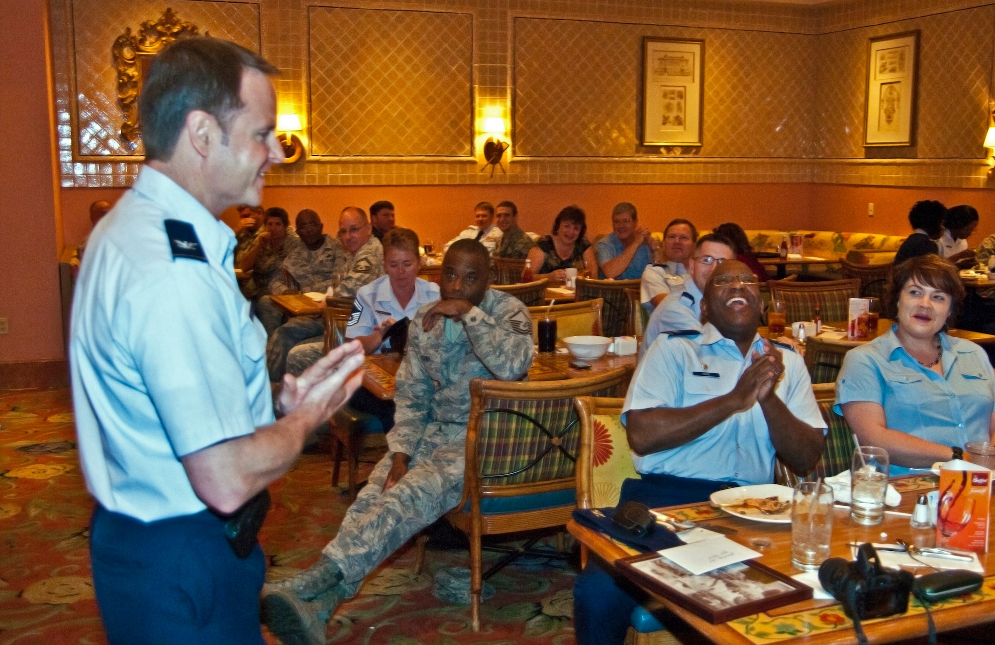 Col. Louis Patriquin, 403rd Operations Group commander, shares his fond memories and funny stories of Col. Marshall Irvin, 403rd Mission Support Group commander, at  Colonel Irvin's going away luncheon held at the Beau Rivage Resort and Casino, Biloxi, Miss., March 21.  Colonel Irvin recently began his new assignment as the 94th Airlift Wing Mission Support Group commander, Dobbins Air Force Base, Ga.  Colonel Irvin served with Reservists from the 403rd Wing from August 2009 to March 2011. (U.S. Air Force photo by Tech. Sgt. Tanya King)