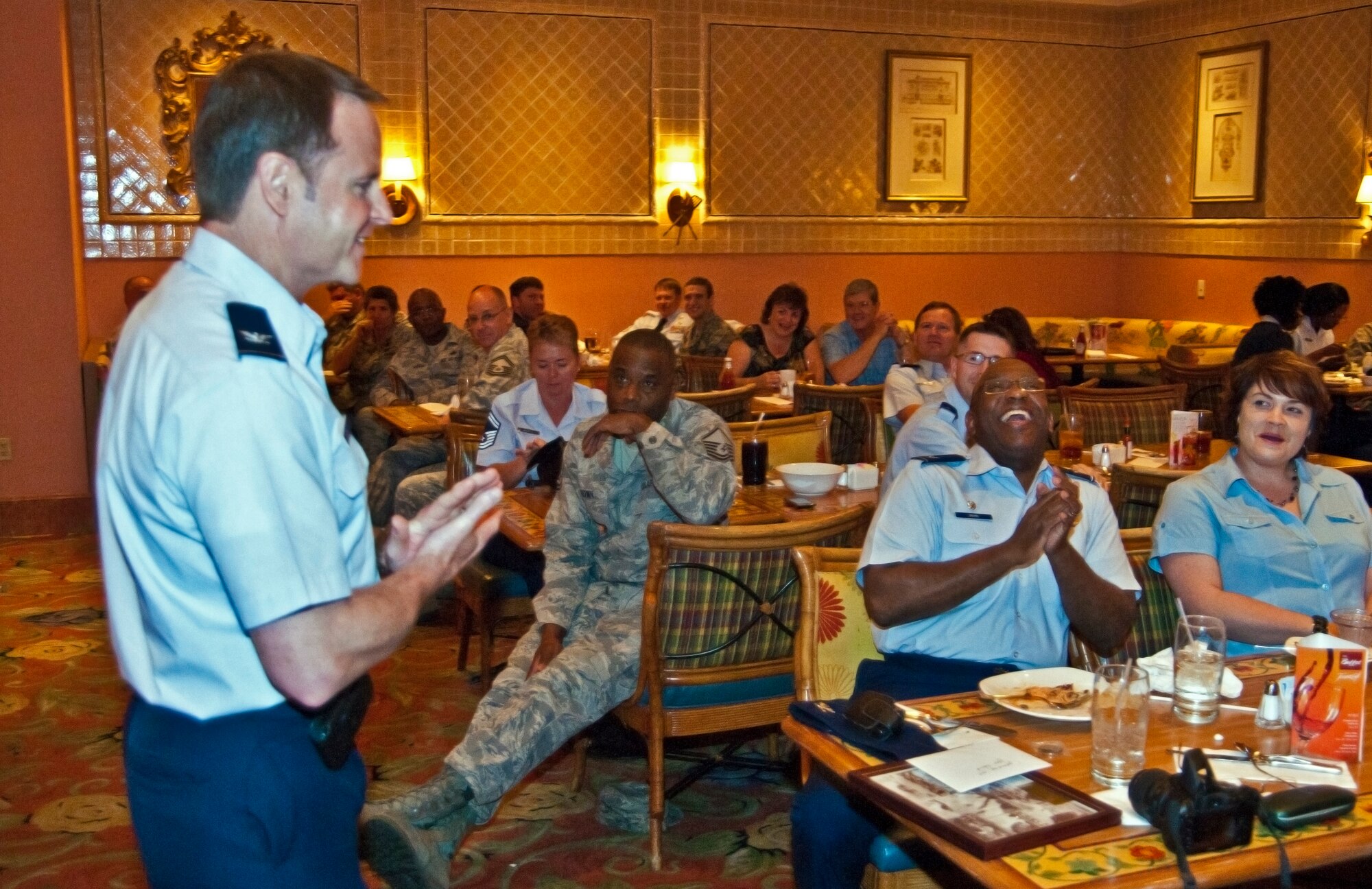 Col. Louis Patriquin, 403rd Operations Group commander, shares his fond memories and funny stories of Col. Marshall Irvin, 403rd Mission Support Group commander, at  Colonel Irvin's going away luncheon held at the Beau Rivage Resort and Casino, Biloxi, Miss., March 21.  Colonel Irvin recently began his new assignment as the 94th Airlift Wing Mission Support Group commander, Dobbins Air Force Base, Ga.  Colonel Irvin served with Reservists from the 403rd Wing from August 2009 to March 2011. (U.S. Air Force photo by Tech. Sgt. Tanya King)