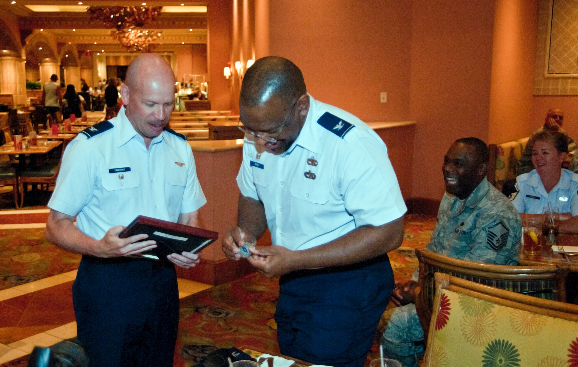 Col. Glen Downing, 81st Training Wing vice commander, presents Col. Marshall Irvin, 403rd Mission Support Group commander, with a few mementos at Colonel Irvin's going away luncheon held at the Beau Rivage Resort and Casino, Biloxi, Miss., March 21.  Colonel Irvin began his new assignment as the 94th Airlift Wing Mission Support Group commander, Dobbins Air Force Base, Ga.  Colonel Irvin served with Reservists from the 403rd Wing from August 2009 to March 2011.