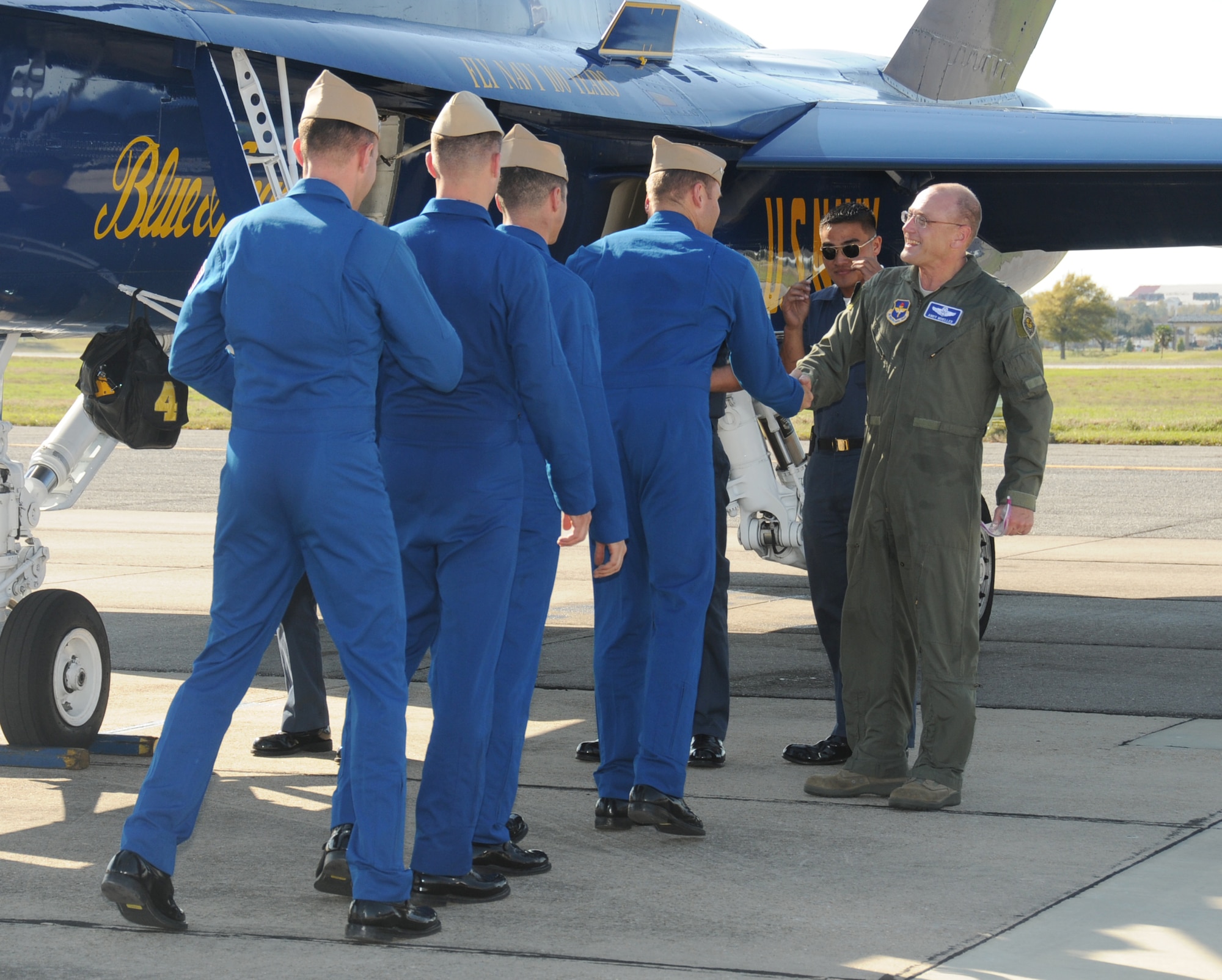 General Mueller, right, greets members of the Navy’s Blue Angels team on the Keesler flightline following a practice flight March 18.  (U.S. Air Force photo by Kemberly Groue)