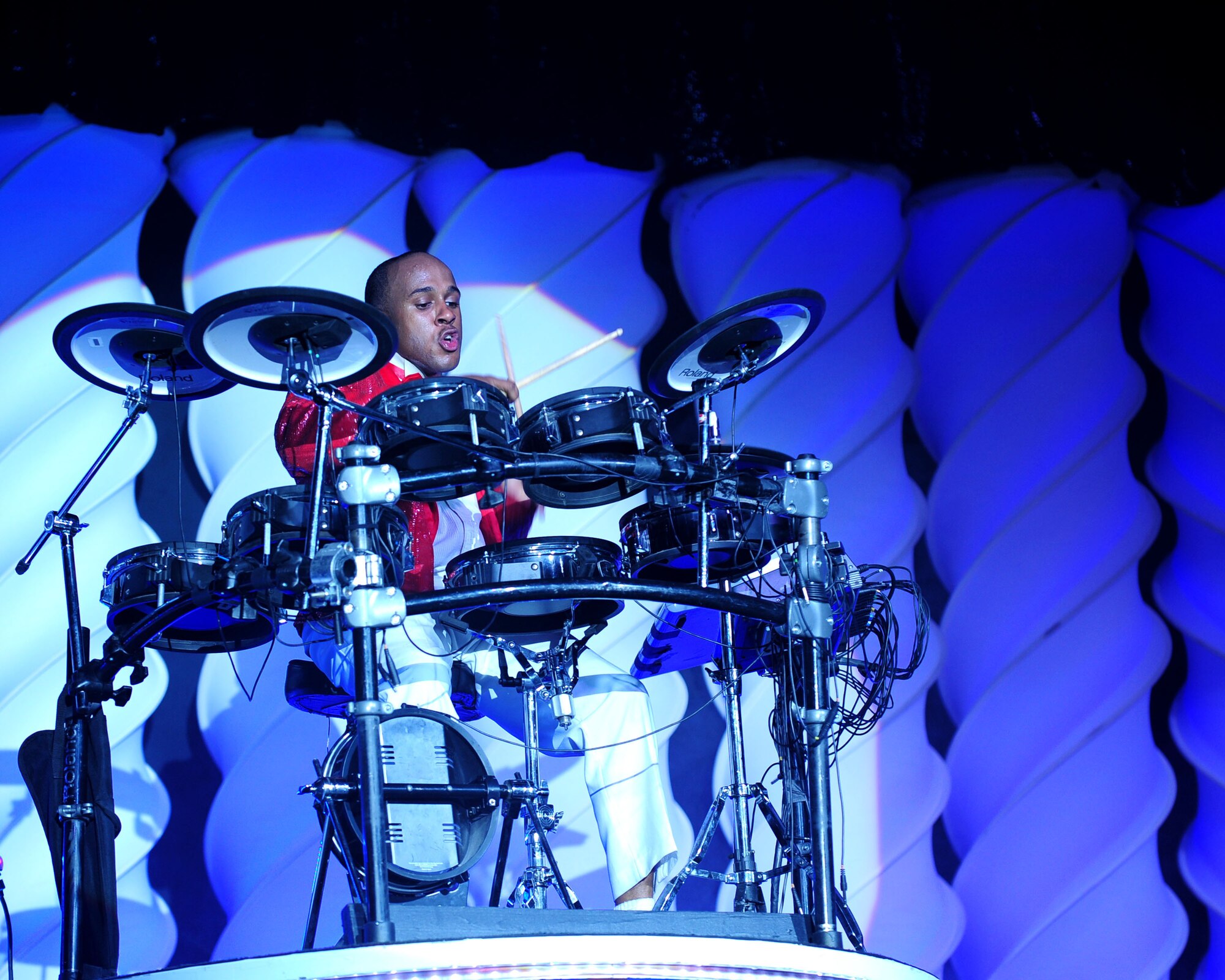 DAVIS-MONTHAN AIR FORCE BASE, Ariz. - Senior Airman Breyson Robinson, drummer for the Air Force’s Tops in Blue performance group, showcases his drumming talent during a recent performance at the Tucson Convention Center in Tucson, Ariz., March 20. Comprised of 35 of the Air Force’s most talented vocalists and musicians, the group performs for Airmen and their families worldwide. (U.S. Air Force photo/Airman 1st Class Jerilyn Quintanilla)