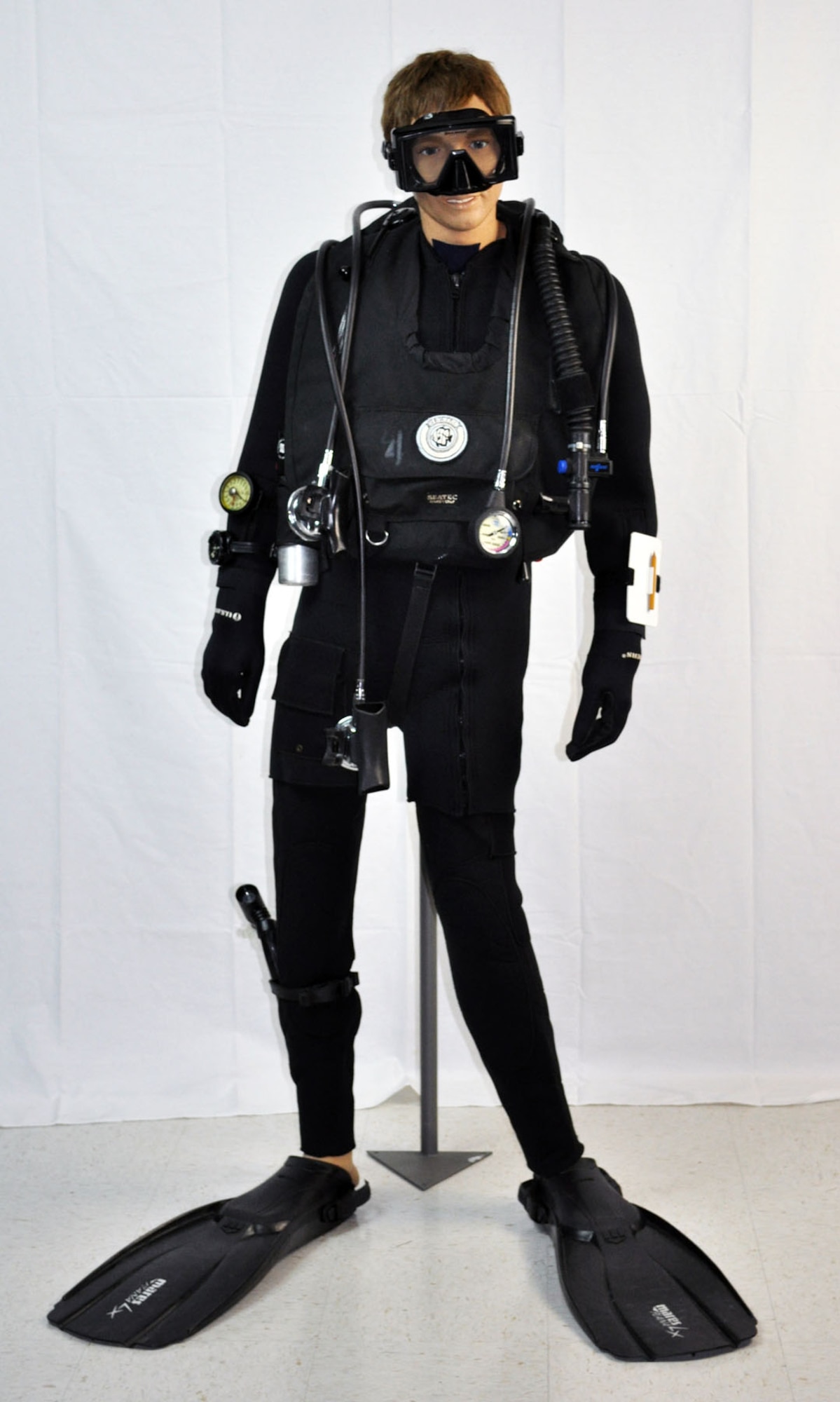 The mannequin pictured represents a pararescueman in scuba equipment used from the mid to late 1970s through the early 1990s. (U.S. Air Force photo)