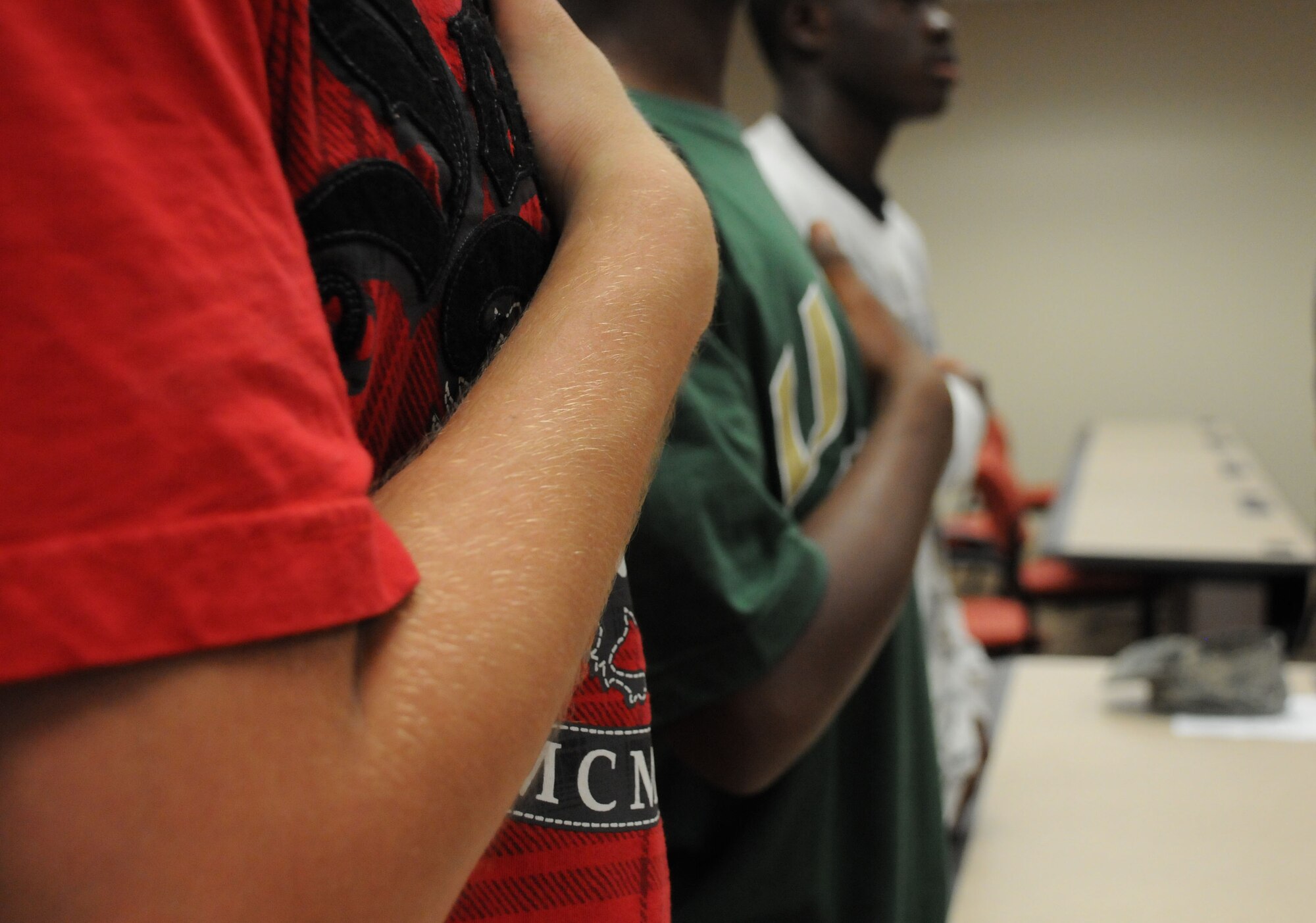 MacDill Air Force Base, Fla. -- As part of their 'induction ceremony,' fourteen children from the Tampa Children's Home said the pledge of allegiance before being issued gear, dog-tags, and a weapons safety brief.  The kids were participating in the unit's 'Reservist For A Day’ event, which gave the children the opportunity to spend time one-on-one with a servicemember and tour MacDill Air Force Base.  (Official U.S. Air Force photo by Staff Sgt. Shawn Rhodes)