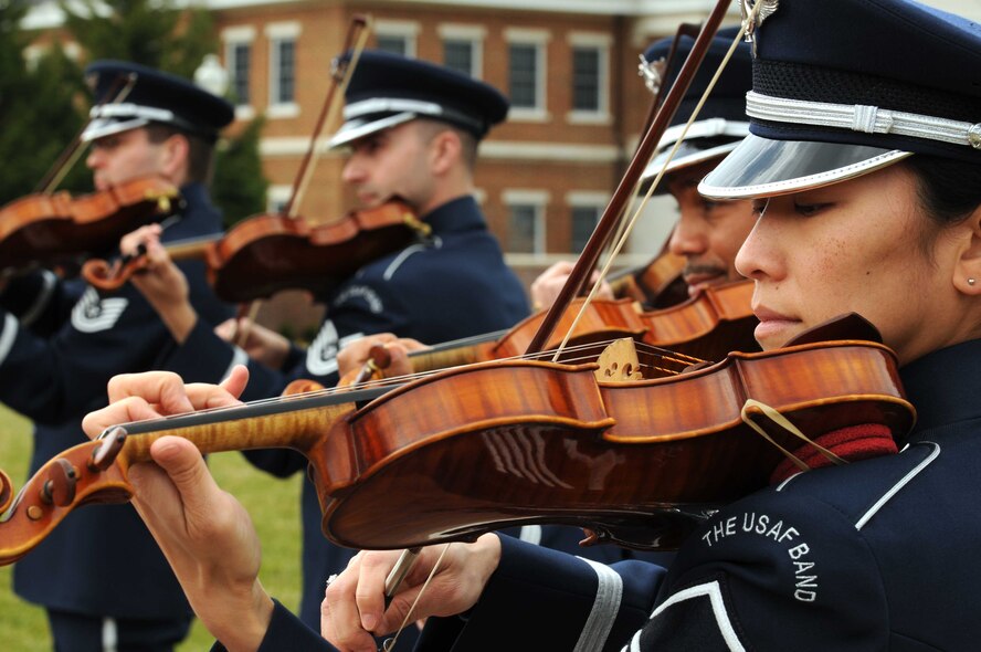 Members of The U.S. Air Force Band, the Air Force Strings, perform for the 11th Operations Group assumption of command ceremony March 22 on the Air Force Ceremonial Lawn, Joint Base Anacostia-Bolling, Washington D.C. The USAF Band and U.S. Air Force Honor Guard showcased their abilities to the new 11th Operations Group Commander, Col. Gina C. Humble. (U.S. Air Force photo by Senior Airman Christopher Ruano)