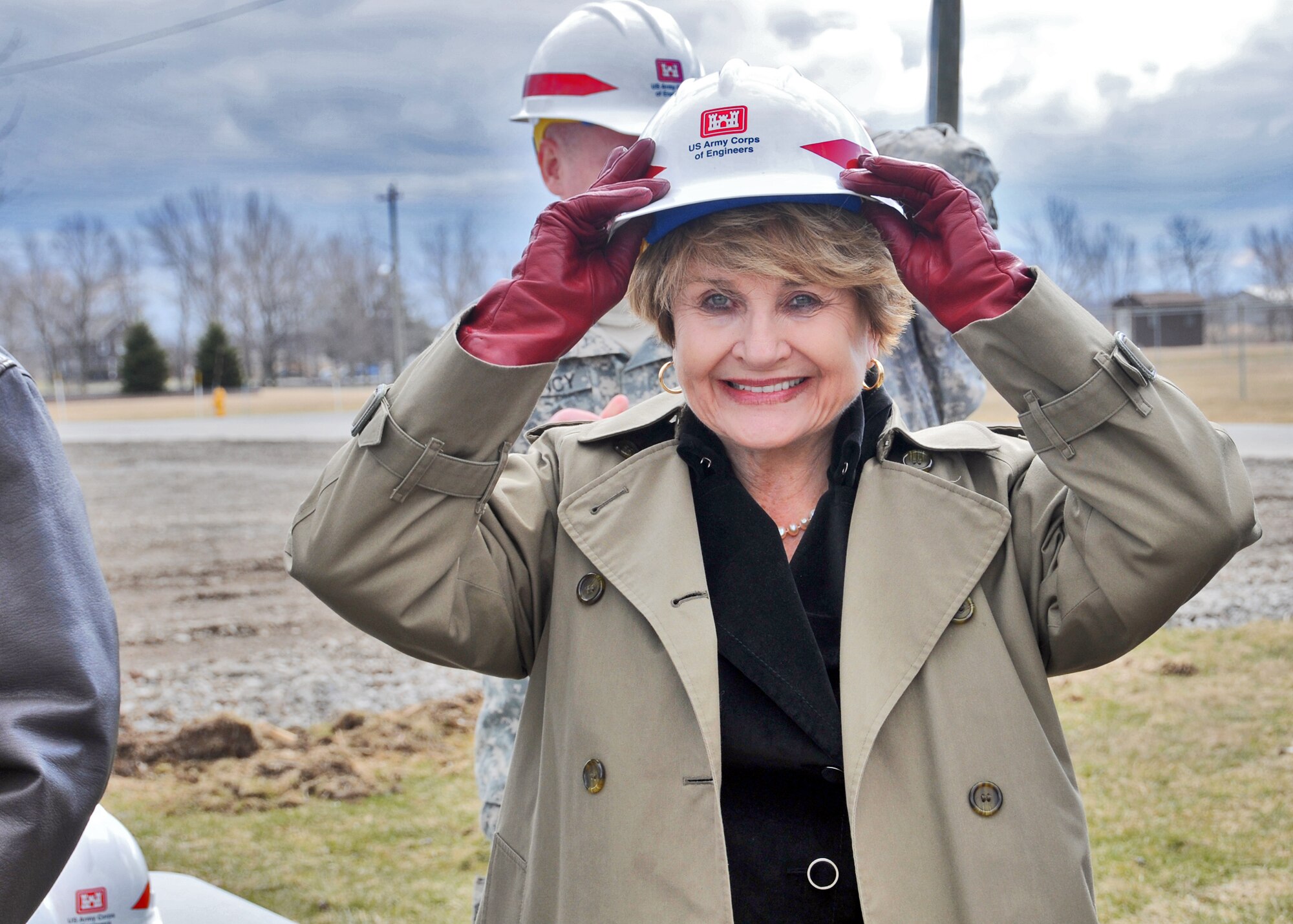 Congresswoman Louise Slaughter tries on a hardhat for a ground-breaking ceremony for a new indoor small-arms firing range at the Niagara Falls Air Reserve Station, March 22, 2011, Niagara Falls, NY. The $6.2 million project aims to make military operations more efficient in western New York. (Air Force photo/Staff Sgt. Joseph McKee)