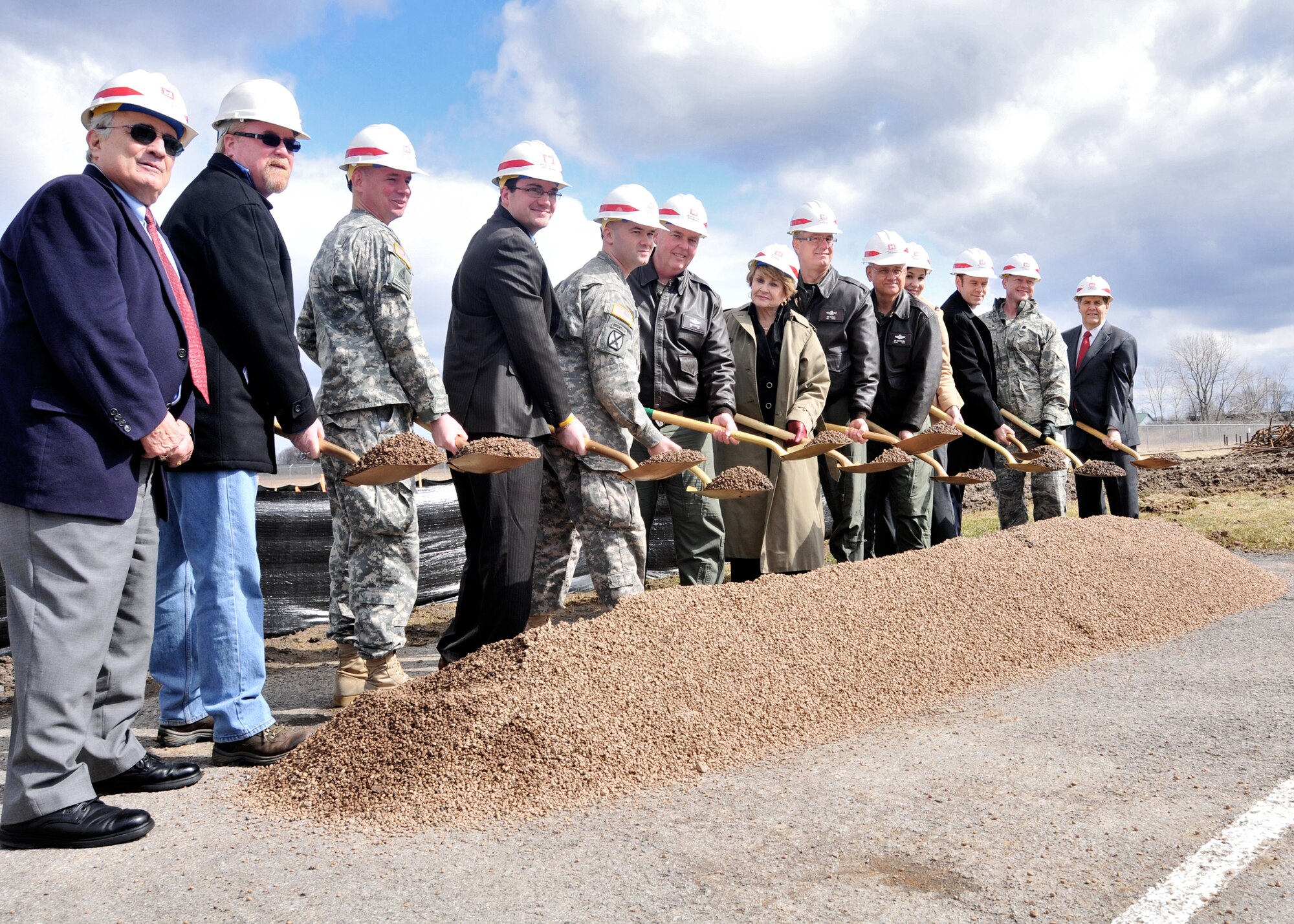 Dignitaries and VIPs break the ground during a ceremony for the Small Arms Range under construction at the Niagara Falls Air Reserve Station March 22, 2011 Niagara Falls, NY. Left to right: Mr. William Ross, Niagara County Legislator., Mr. Robert Burke Contractor, LtCol Michael Clancy-Army Corp of Engineers, Mr. Vince Sandonato,Representing Mark Grisanti, Capt James Birk, Buffalo MEPS, Col. Mark Murphy, 914th Airlift Wing Commander , Congresswoman Louise Slaughter, Col. Jim McCready, 107th Airlift Wing Commander, Major. Gen. James Kwiatkowski, New York Air Natioanl Guard Commander, Melissa Fratello, Representing Senator Gilliband, Mr. Walt Koch, Representing Brain Higgins, LtCol Gregory Ottoman, HQ AFRC/A7P, Mr. Merrell Lane, President, Niagara Military Affairs Council. (Air Force photo/Staff Sgt. Joseph McKee)