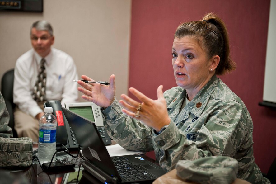 Maj. Connie Van Hoesen, Air Traffic Systems Evaluation Program team chief from Langley Air Force Base, Va., addresses her team during an end-of-day meeting March 22 at the 23rd Operations Support Squadron base operations building, Moody Air Force Base, Ga. The goal of the ATSEP is to evaluate how well the 23rd OSS supports Moody’s flying mission on and off base. (U.S. Air Force photo/Staff Sgt. Jamal D. Sutter)(RELEASED)